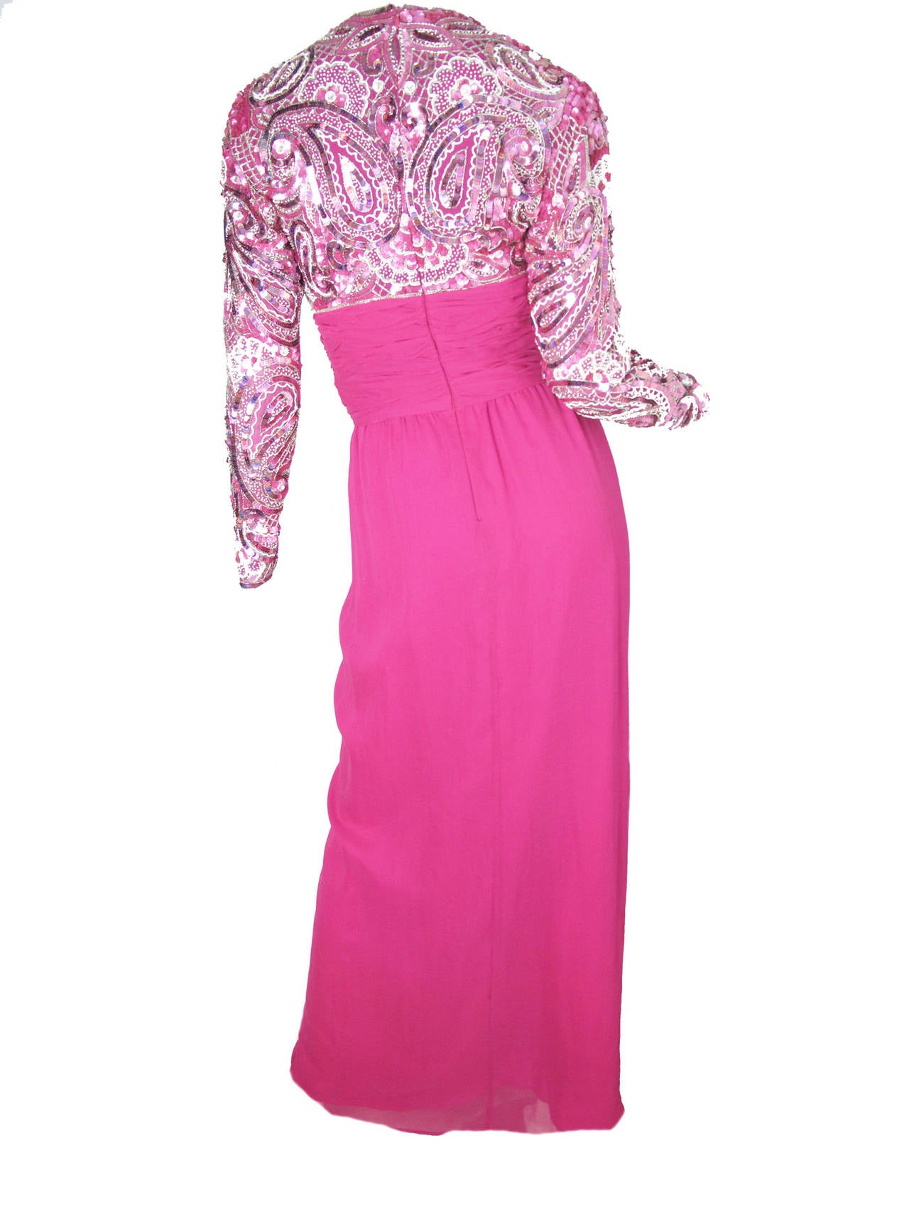 1980s Naeem Khan Riazee Nights fuchsia silk gown with beading and sequins.  Condition: Very good, a few beads missing.  Two bags of extra beading attached.  made in India. 
35