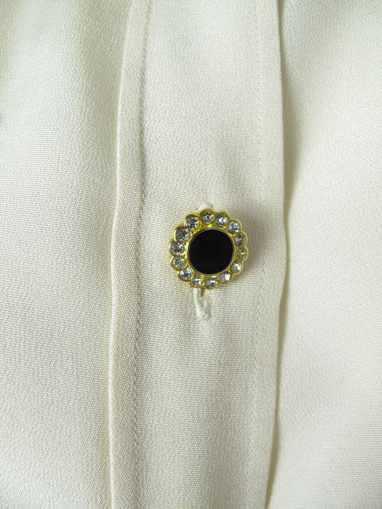 Yves Saint Laurent creme silk blouse with rhinestone buttons.  42