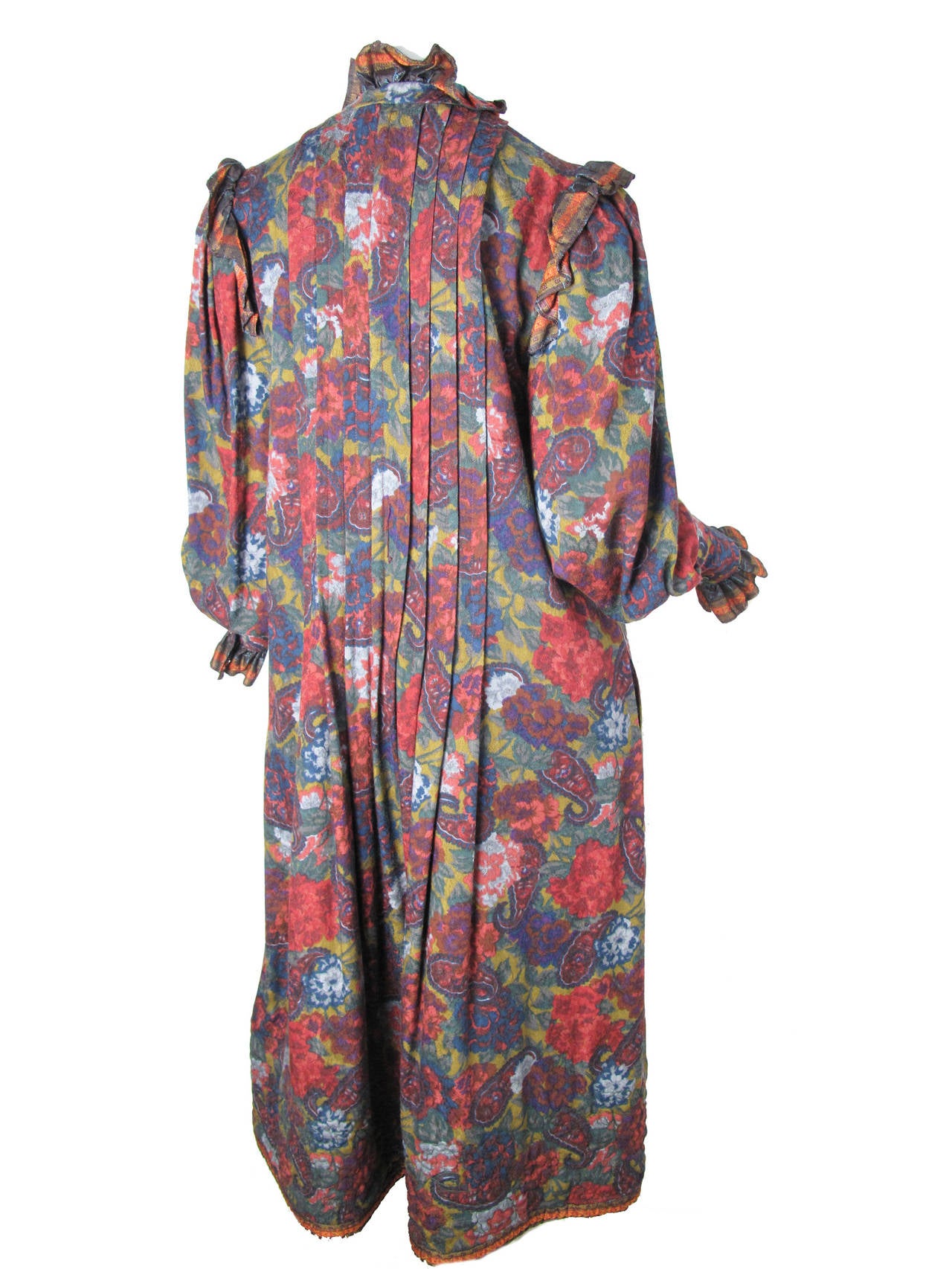 Oscar de la Renta floral wool peasant dress with ruffle collar and cuffs.  Quilting at hemline.  Pockets.  Has belt loops but missing belt.  Belt in photo does not come with dress. Condition: Very good. Size

38