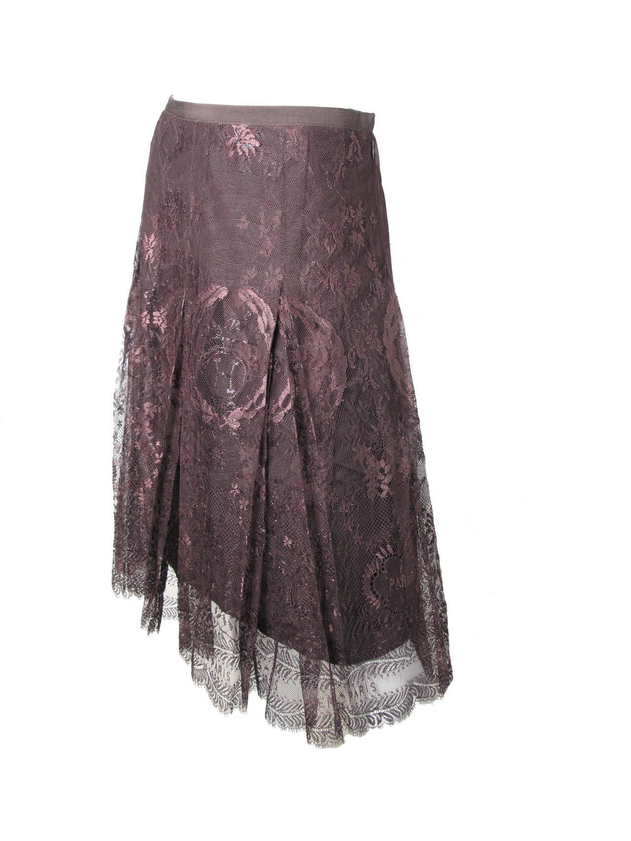 Wonderful Hermes reddish brown lace skirt with Hermes logo and Paris throughout.  Created by Jean Paul Gaultier for Hermes runway 2006.  Strong lace fabric made of Polyamide, tactile and polyester.  Wool & silk brown lining. 
Grosgrain ribbon