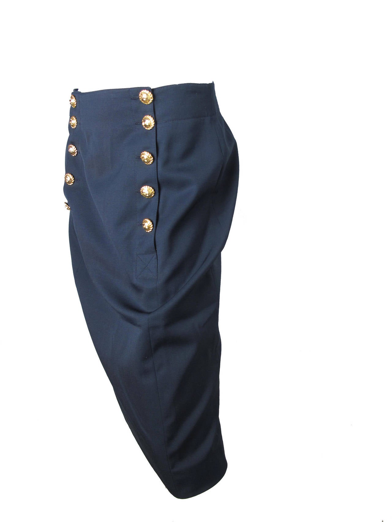 1970s Celine navy wool skirt with button detailing down front.  Made in France.

Condition: Excellent. Size 46

29