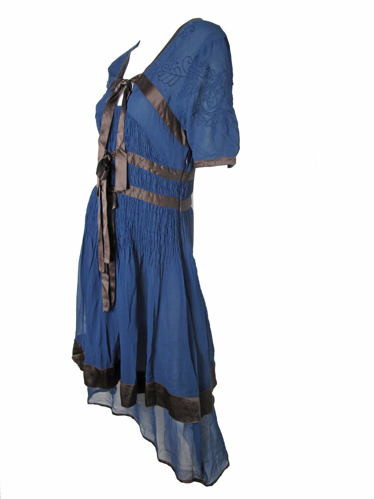 Jeans Paul Gaultier navy chiffon dress with brown satin bows and trim.  Condition: Excellent.  

35