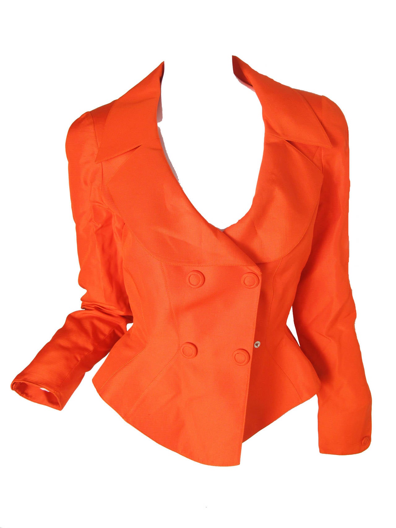 1980s Thierry Mugler orange silk jacket with covered snaps, fitted waist and mini skirt.  
Skirt: 23 1/2