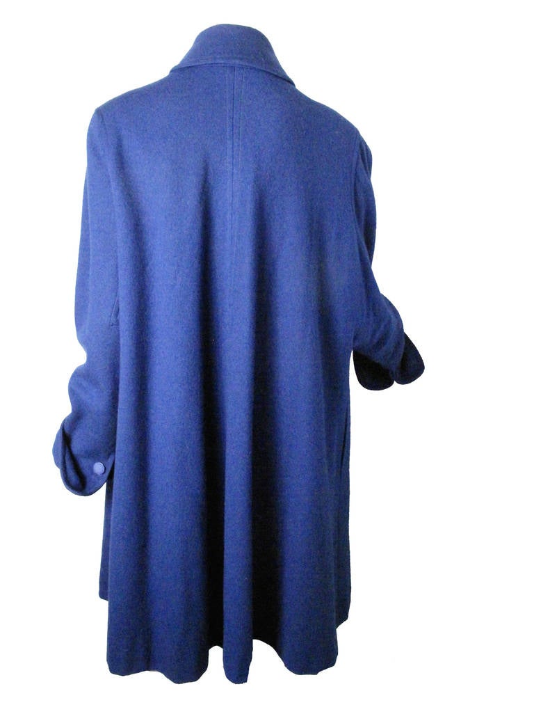 1950s Jacques Fath blue wool coat.  24" sleeve, 51" bust, 39 1/2" length. Condition: Excellent. Size Large
