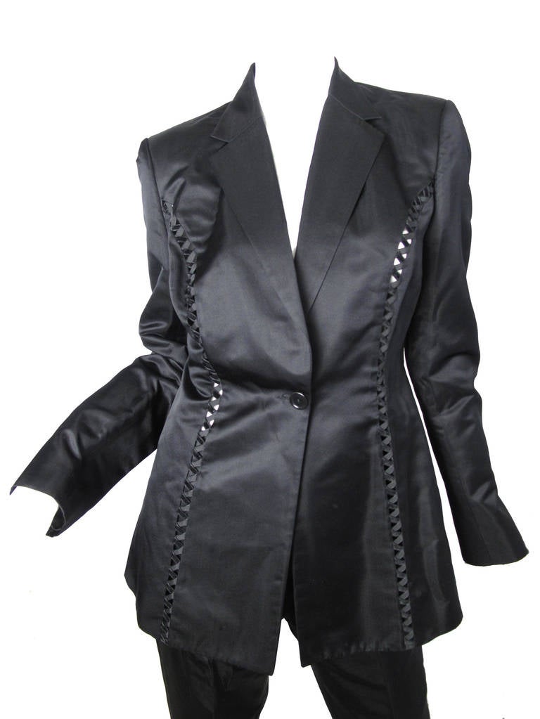 Richard Tyler Couture silk/rayon evening suit with criss cross cut out detailing on front and back. 
Jacket: 36