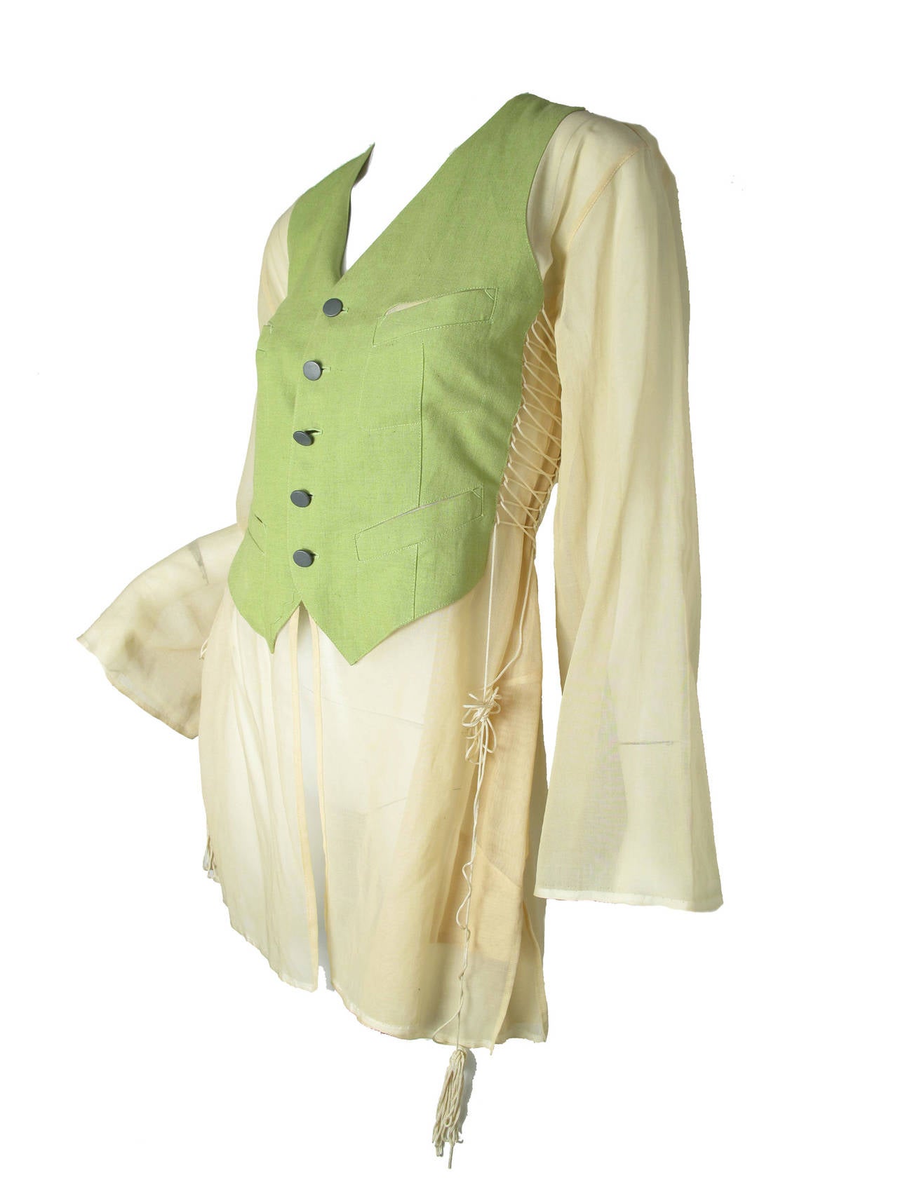 1990s Jean Paul Gaultier cream sheer blouse with attached green linen vest. Lacing on sides can be loosened. 32