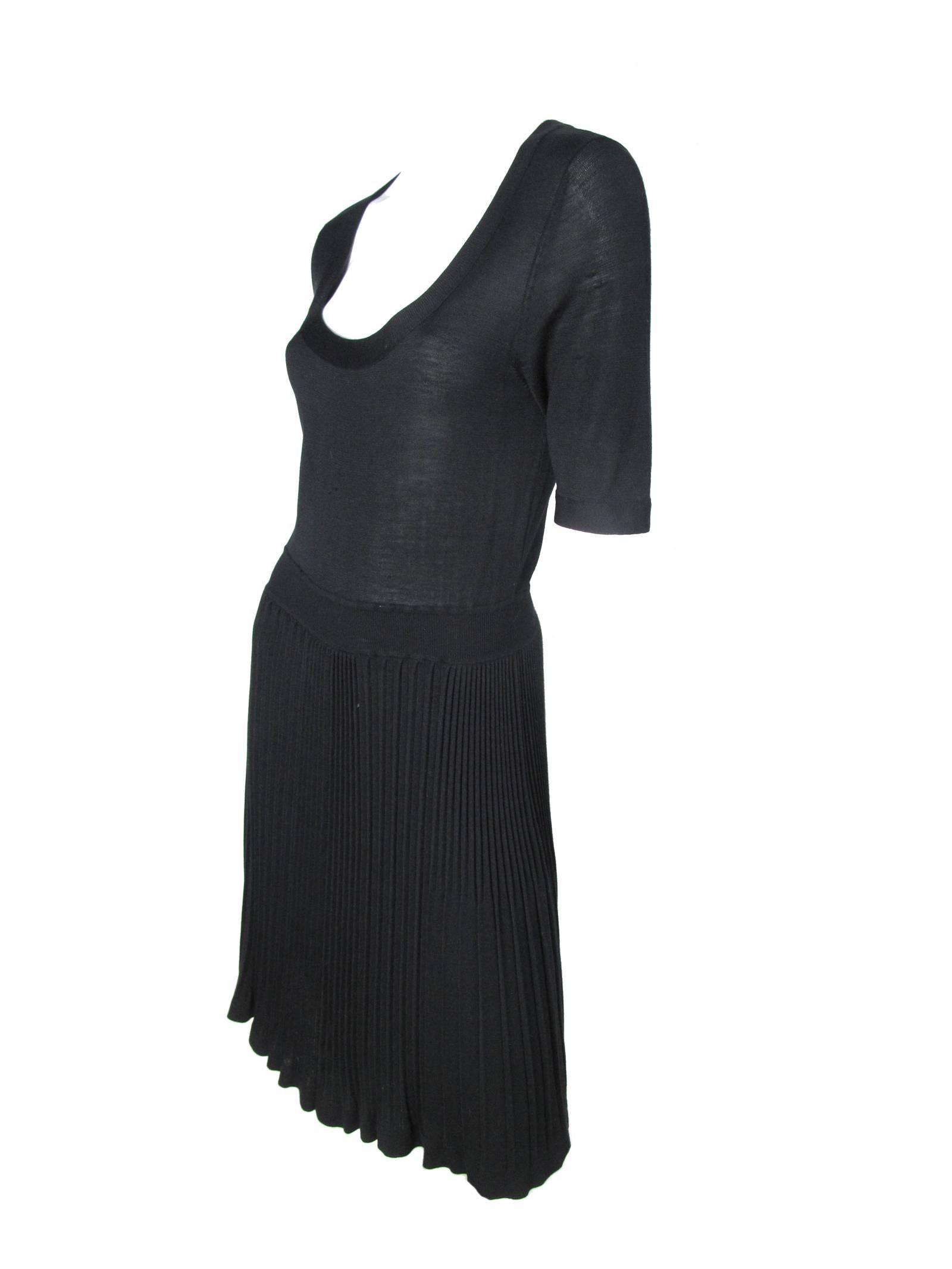 Black knit Balenciaga silk/ cashmere dress with pleating.  Condition: Good, some small pulls on front and sleeve.  Size 40/ US 6 

31