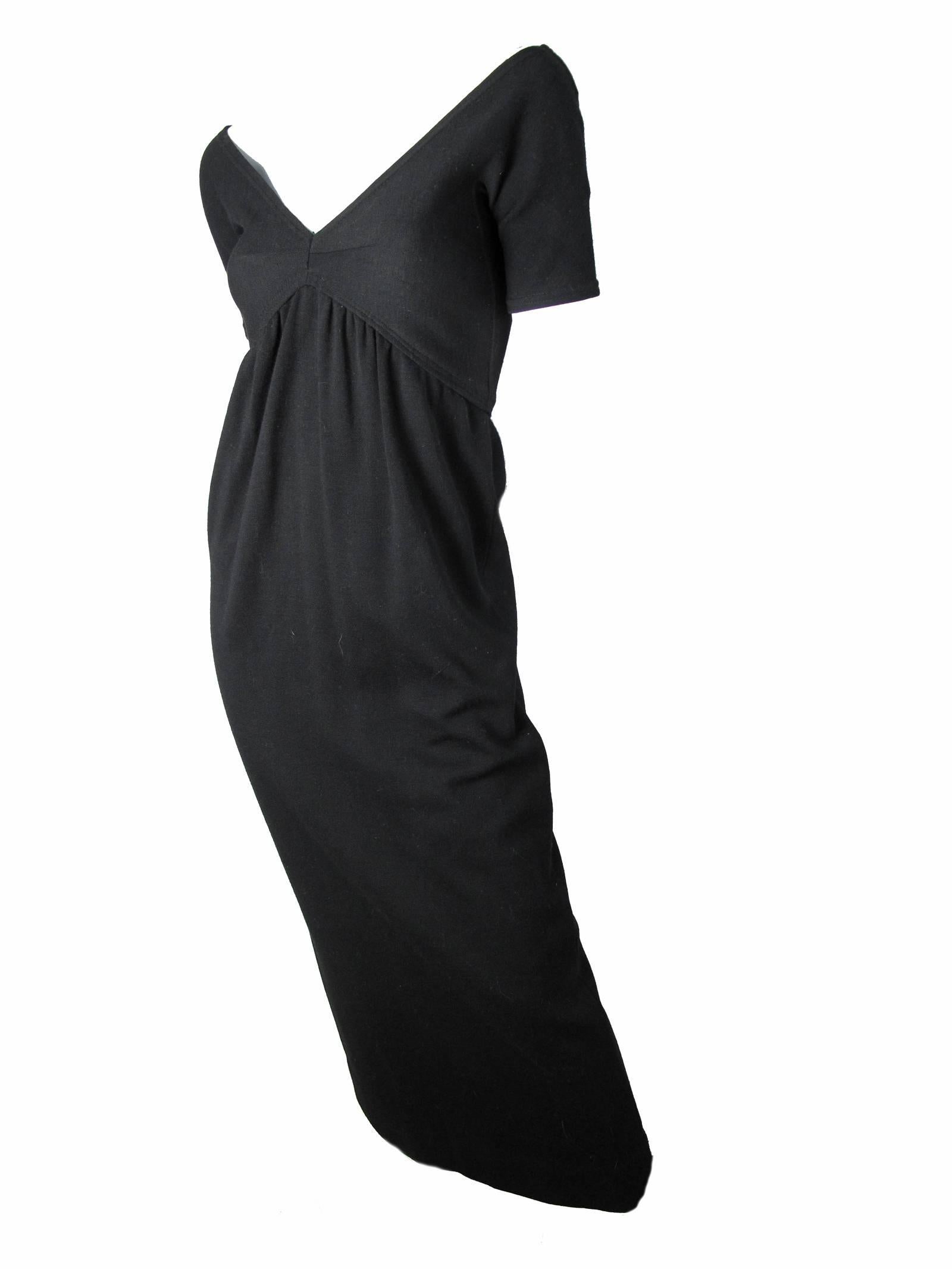 1970s Rudi Gernreich black wool column gown with small capped sleeves and v neck line. Condition: Very good. Marked size 8 but fits current US 6

31
