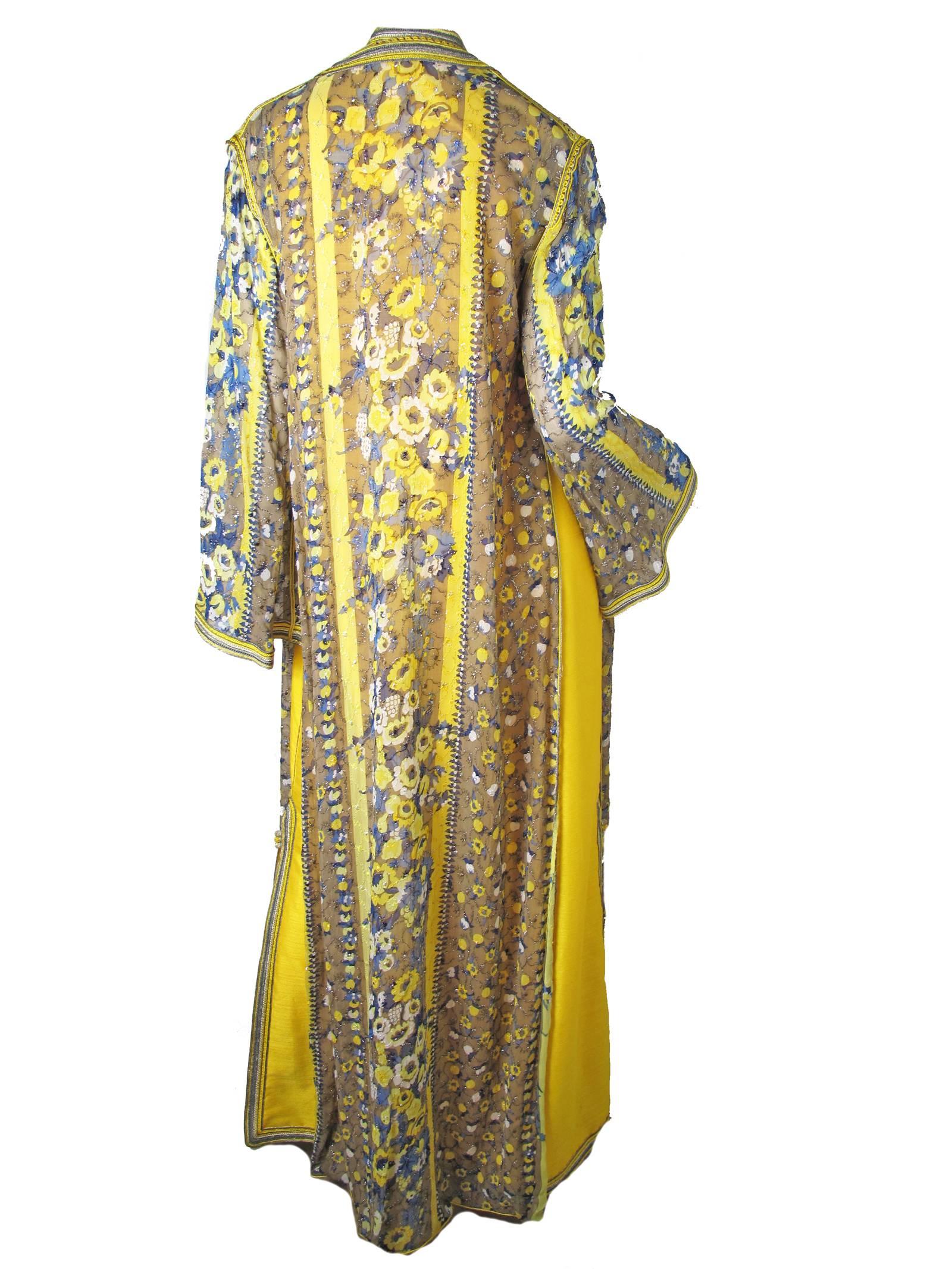 1960s Naima's caftan from Rabat Hilton Maroc.  Yellow sleeveless gown with side slits and crocheted buttons down front.  No fabric label, possible silk blend.  
Sheer chiffon floral over coat with hand embroidery. Size Large

Condition: Yellow