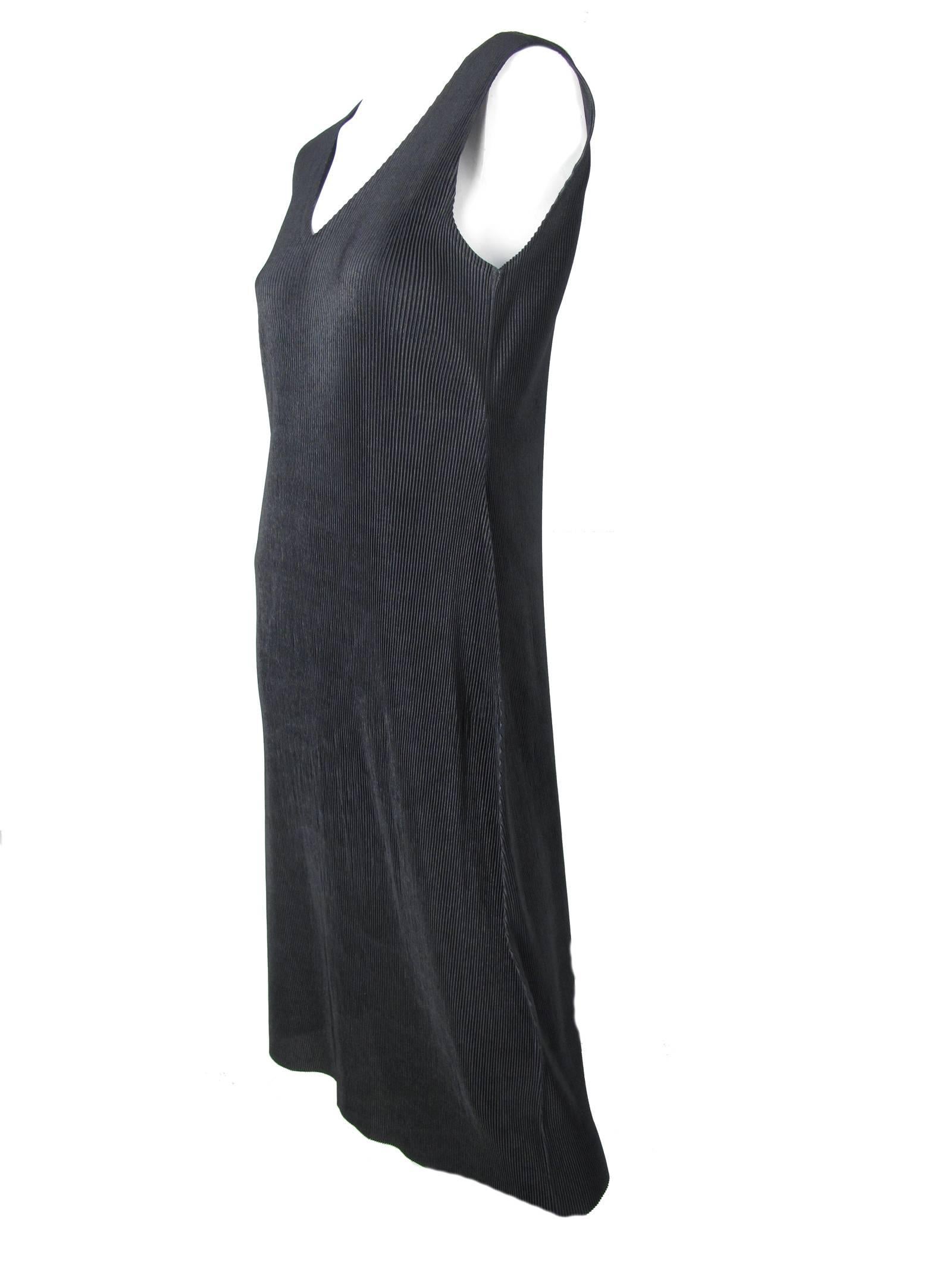 Issey Miyake black pleated sleeveless dress.  Polyester. Condition: Excellent.  Made in Japan.Size 3
We accept returns for refund, please see our terms.  Free Ground Shipping within the US! Please let us know if you have any questions.