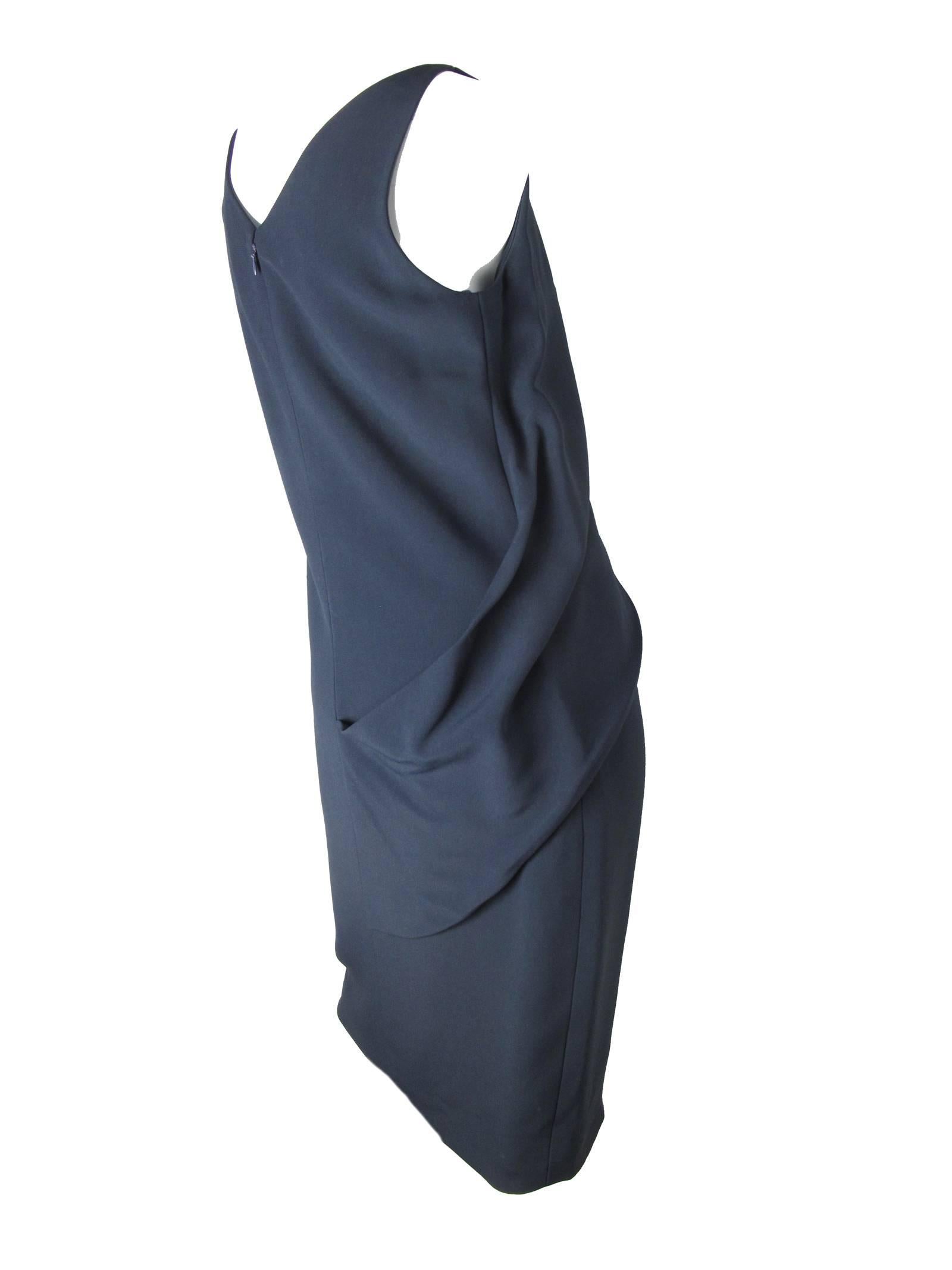 Balenciaga “Le Dix” navy dress, sleeveless. Silk lined, Acetate and Viscose fabric. Size 42 / US 8 ( mannequin is a size 6 ) 
34" bust, 35" waist, 40" length.

We accept returns for refund, please see our terms.  We offer free