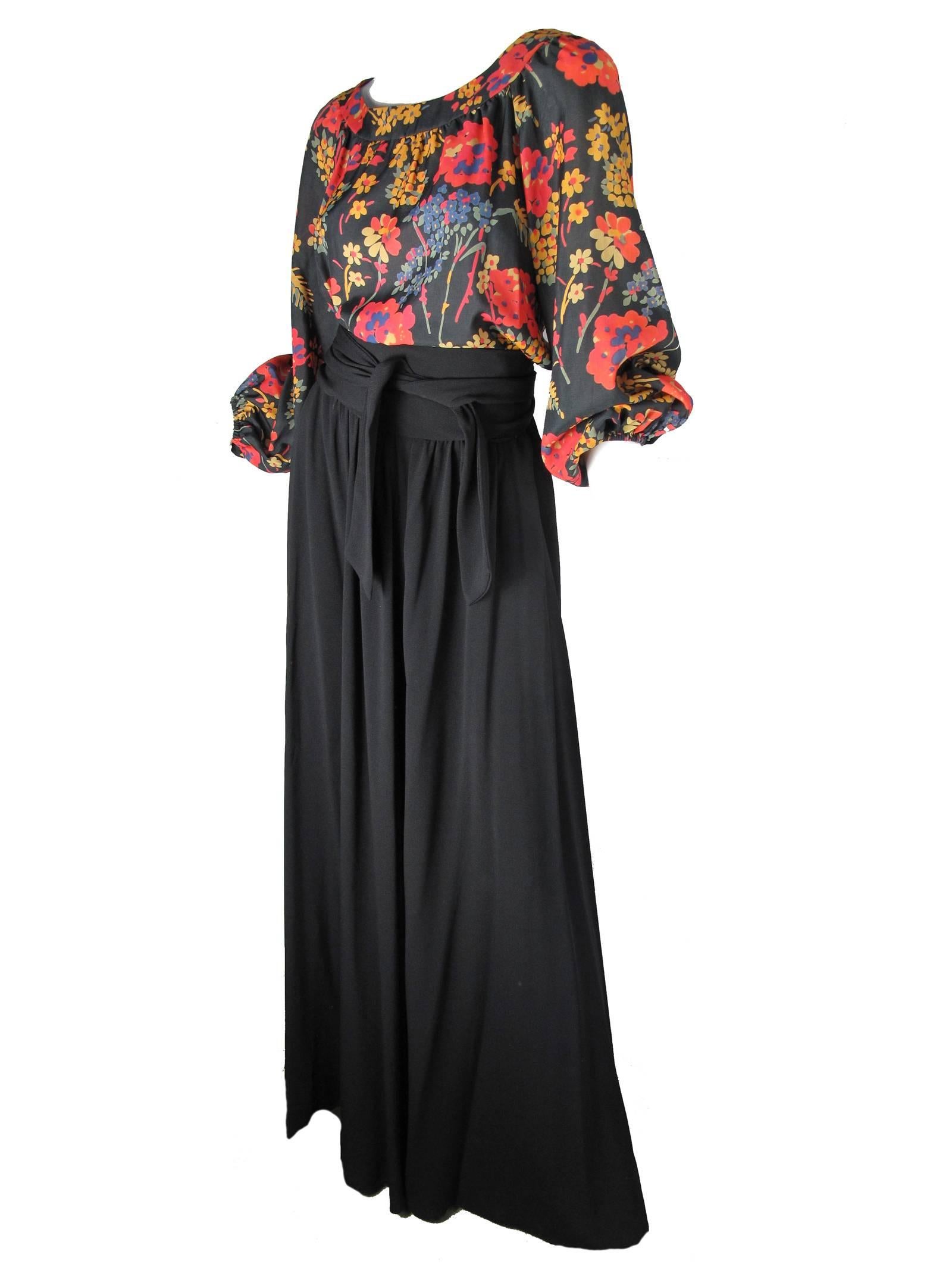Oscar de la Renta long black crepe evening skirt, cumberbund self belt with side pockets.  Floral silk peasant blouse with scoop neck and snaps up back.   Condition: Excellent.  Size 6 
Measurements taken flat and doubled:
top: 38