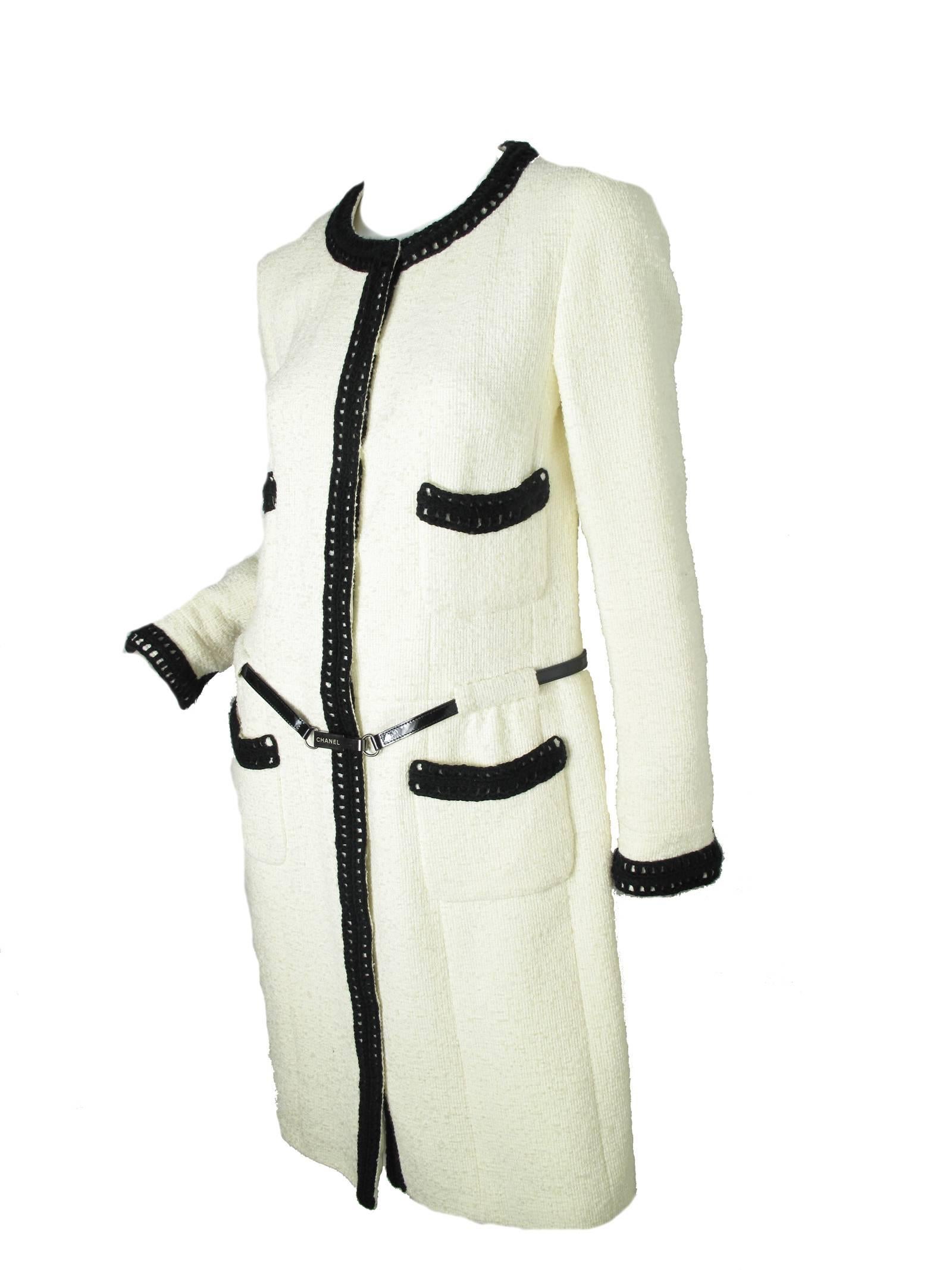 2000 Chanel boucle off white dress, black crochet trim, black patent belt. Snaps to close. Nylon, wool, mohair, rayon. Four front pockets. Size 40 / US 8 - 10 
Condition: good, all over wear and discoloration under arms and collar. 
*only the dress