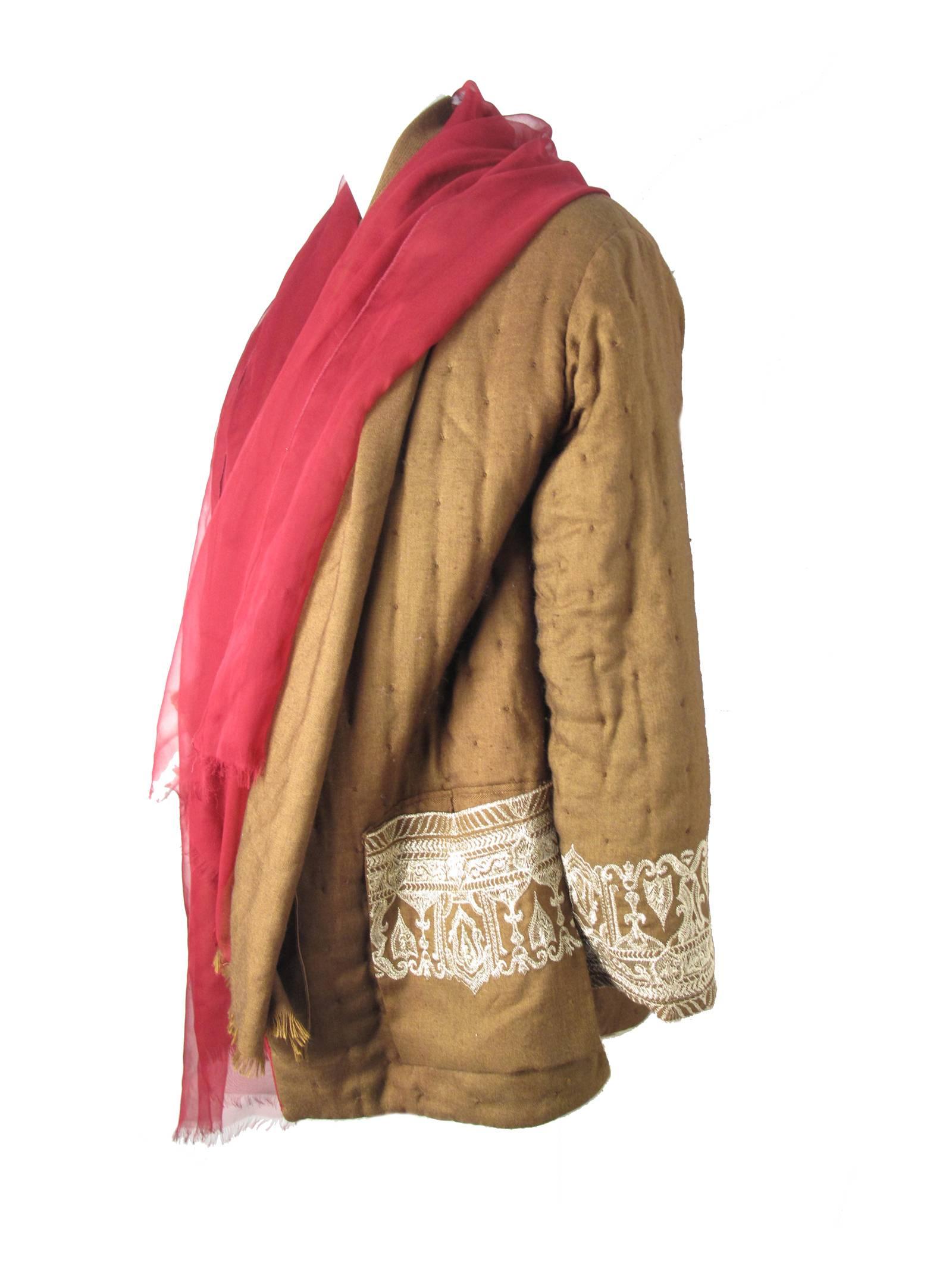1990s Gianfranco Ferre reversible coat with large attached wool and chiffon scarf. Pockets on both sides. Gold embroidery on brown side on pockets and cuffs. 60% silk, 30% poly 10% cashmere. Condition: Very good, a few spots on scarf, and on water