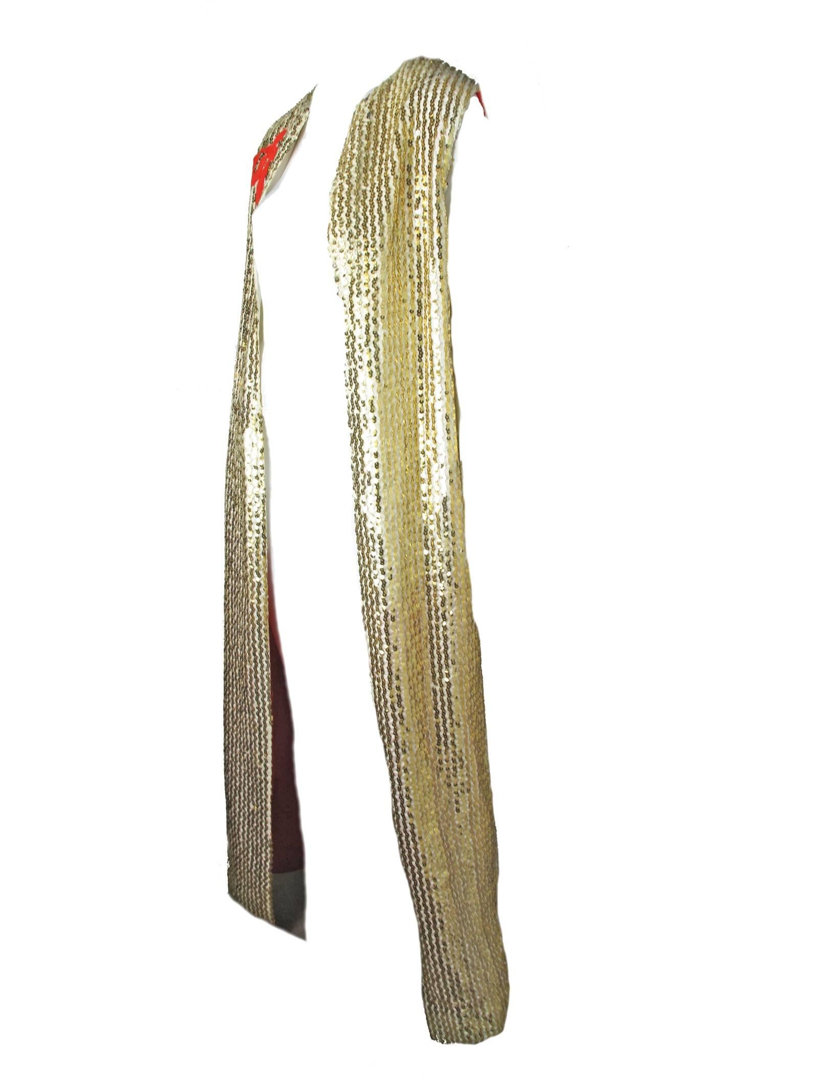 1970s Oscar de la Renta gold sequined sleeveless floor length vest. Condition: Very good vintage condition, some moth holes in the lining, see photos. One sequin missing at back top at neck.  Size M-L
36