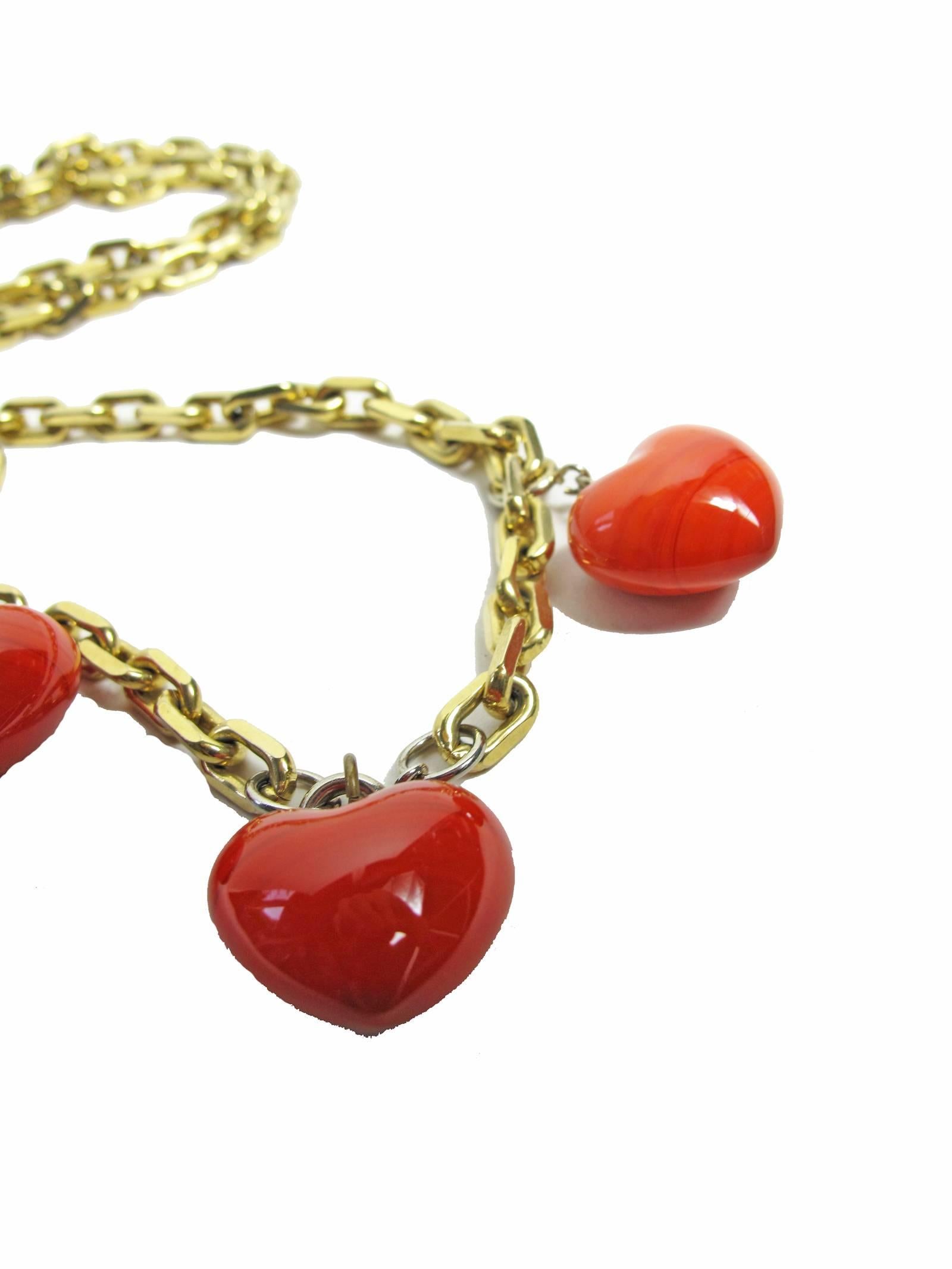 Three red dyed heart shaped agate on long chain necklace.  Condition: Excellent.  One size 
We accept returns for refund, please see our terms.  We offer free ground shipping within the US. Please let us know if you have any questions.