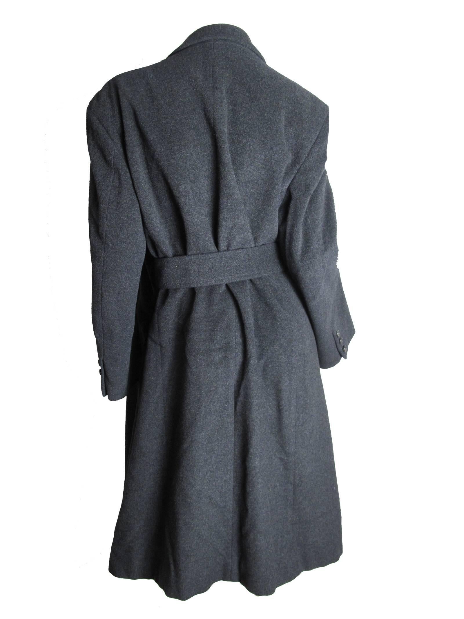 Comme des Garcons grey wool coat with belt.  Condition: Good, some tears to interior lining.  Size M 
