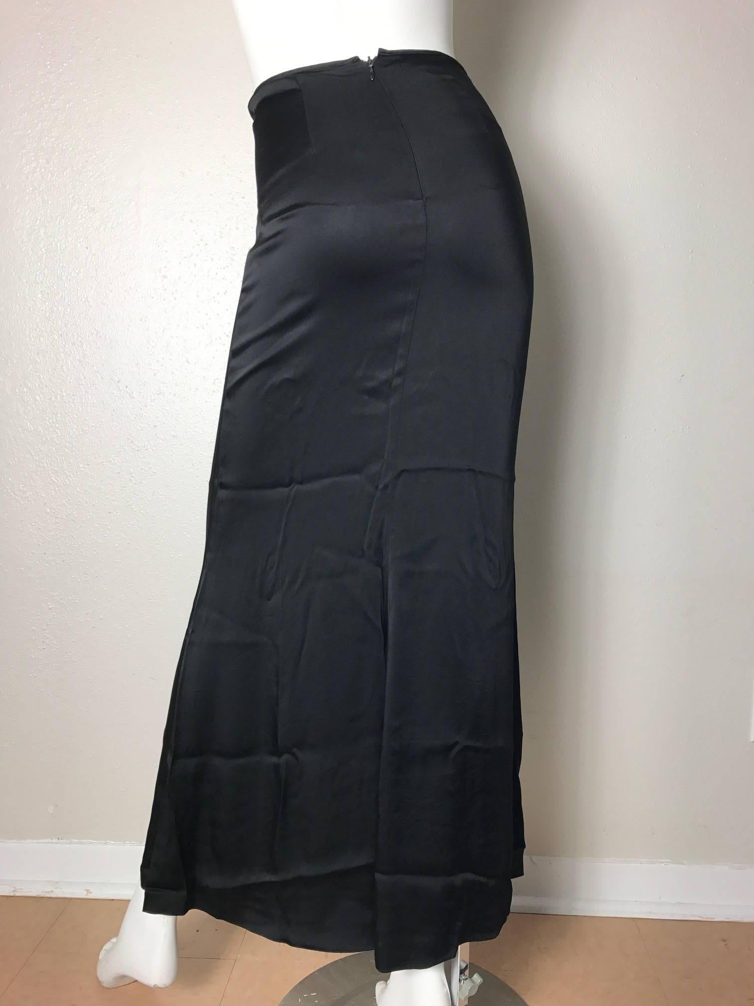 1990s Jean Paul Gaultier Classique satin skirt.  Condition: Excellent. Size 6

We accept returns for refund, please see our terms.  We offer free ground shipping within the US.  Please let us know if you have any questions.
