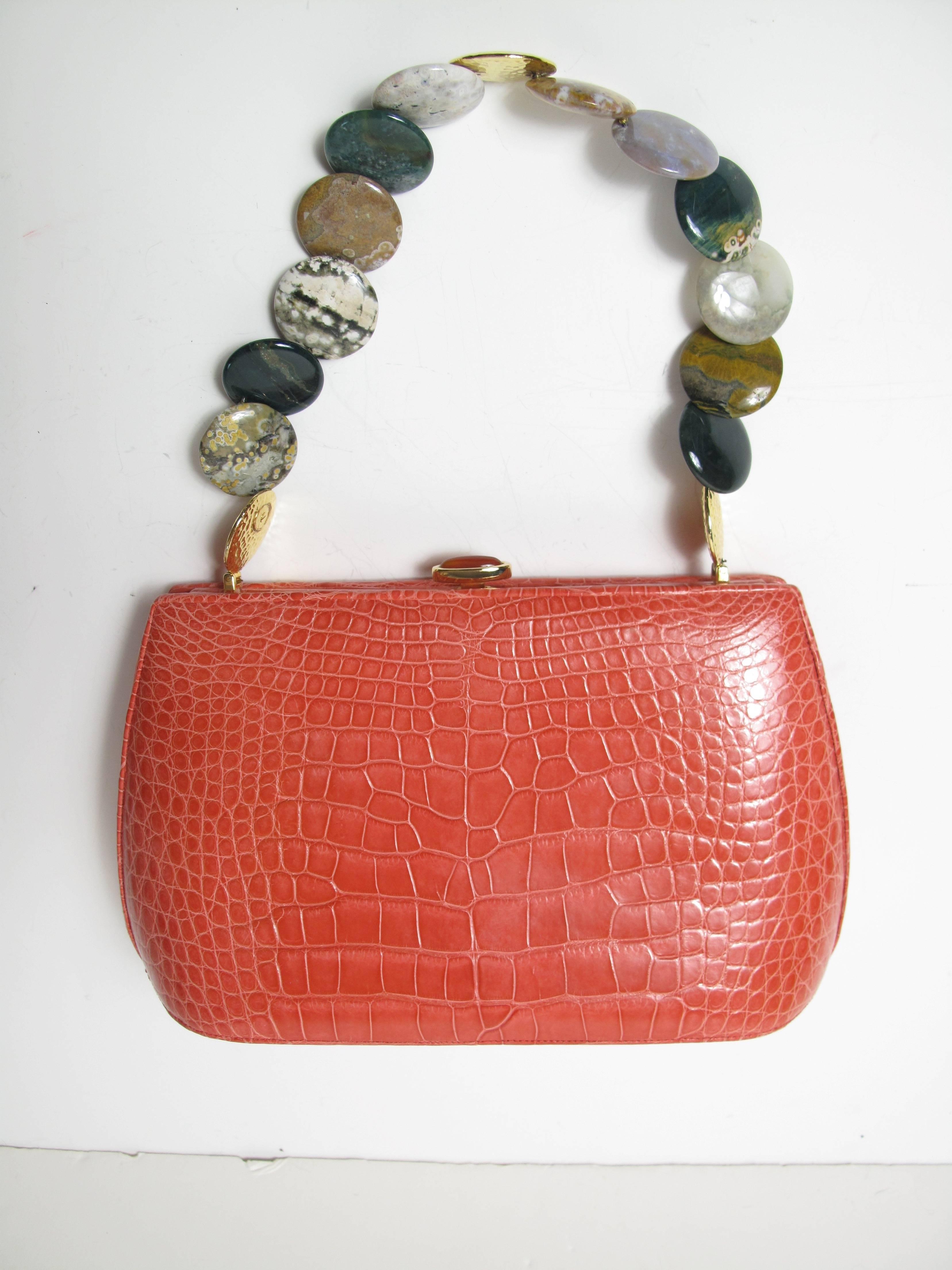 Judith Leiber alligator bag with polished stone strap.  Condition: Excellent, very little wear to bottom.   

We accept returns for refund, please see our terms.    Please let us know if you have any questions.