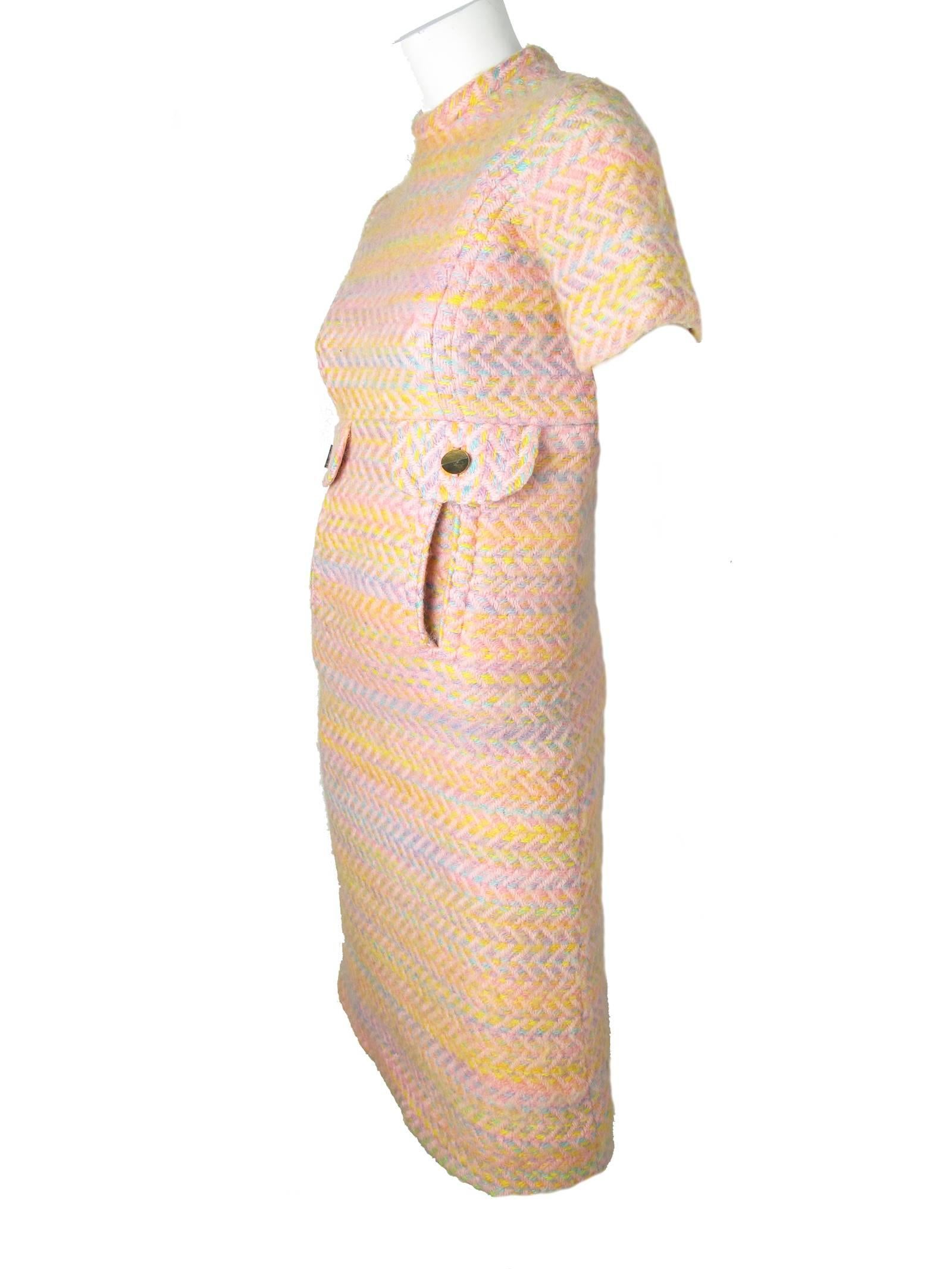 1960s Bill Blass pastel wool dress with interesting front slashed pockets.  Condition: Good, a little fuzzy all over.  
Size 2 - 4
33" bust, 28" waist, 36" hips, 8" sleeve, 14" shoulder, 40" length.