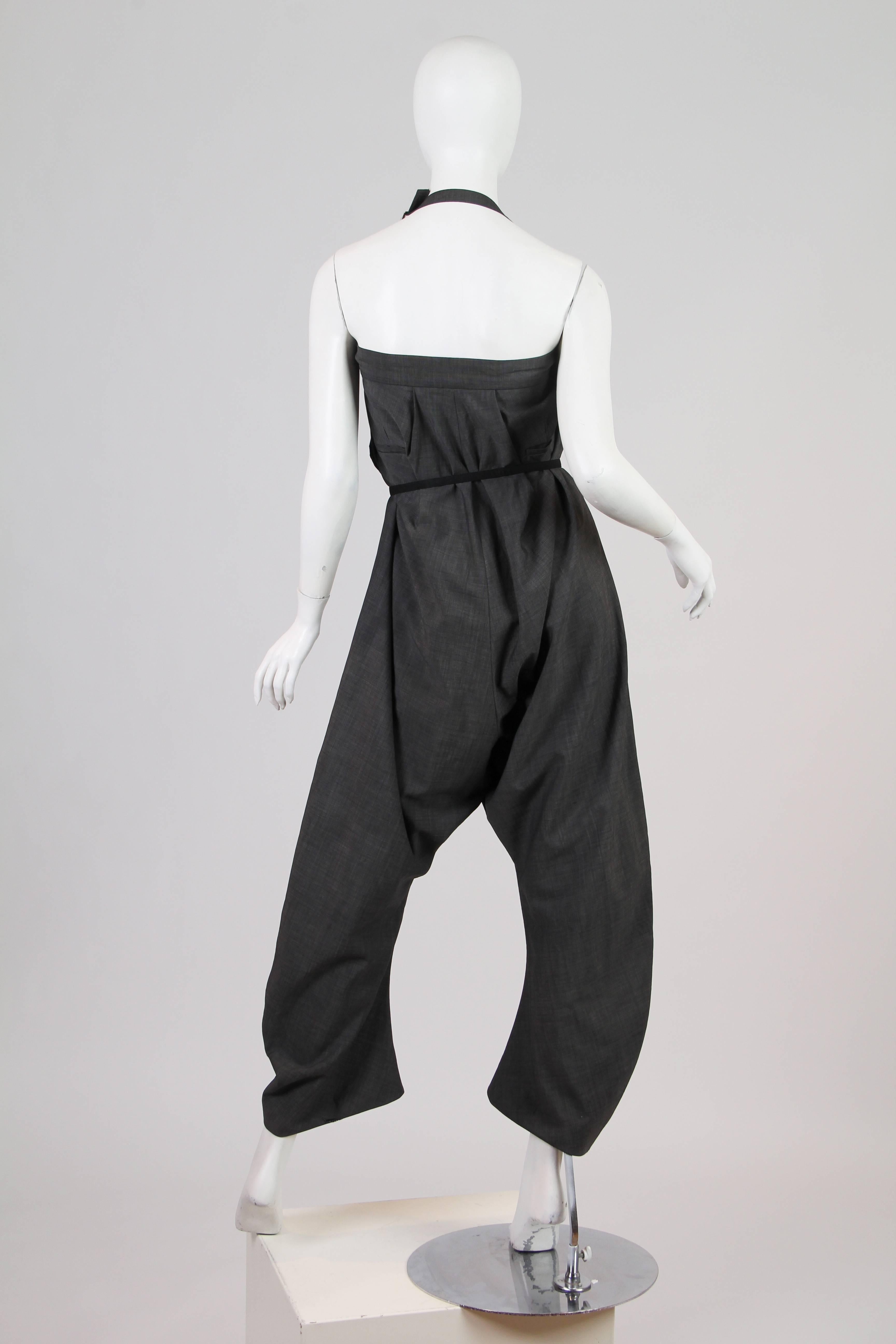 John Galliano trousers, possibly a men's, with an interesting strap inside which can convert the trousers into a jumpsuit. The sash does not come with the trousers we've just used it to show what they would look like belted. 