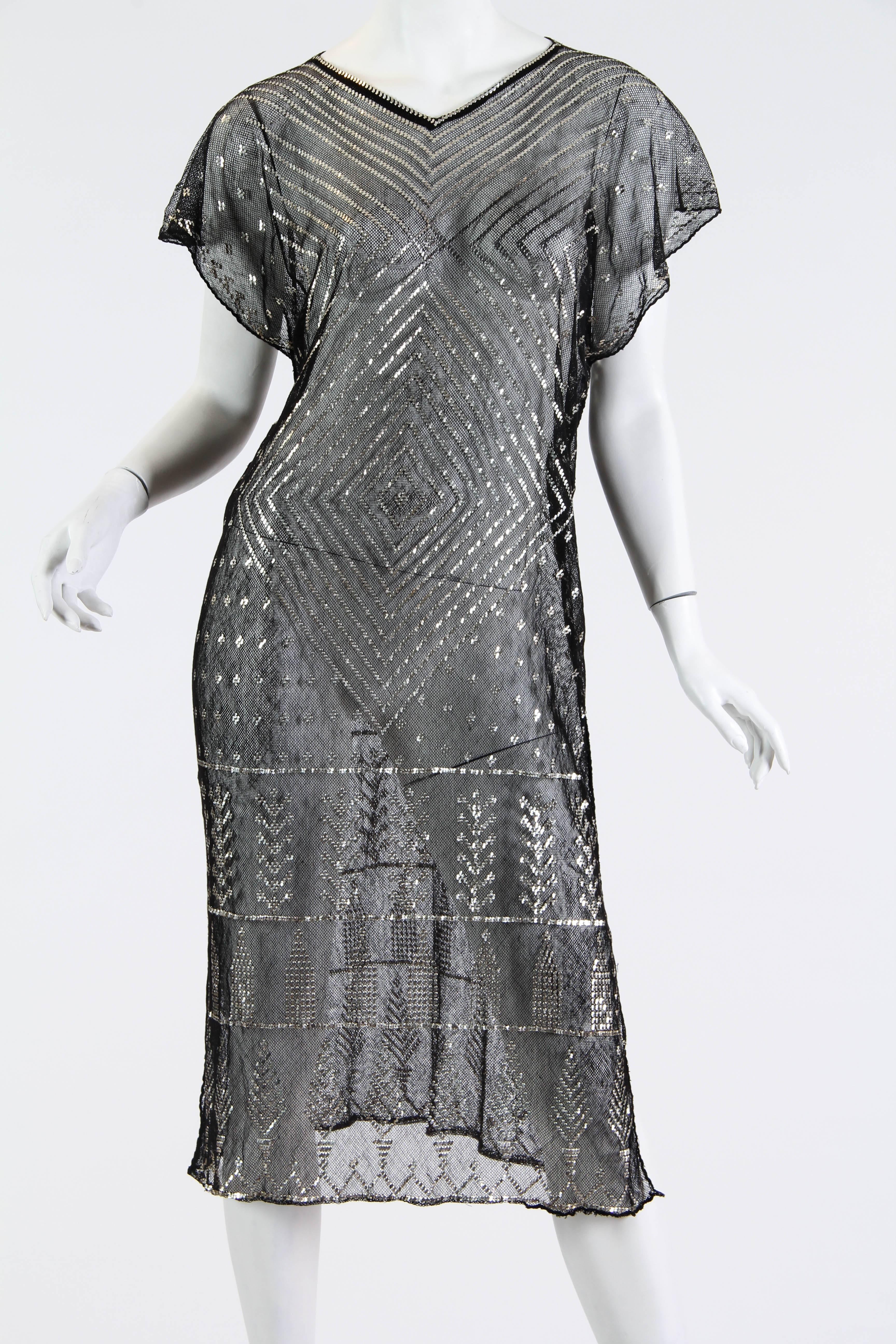 1920s Egyptian Assuit Metal and Cotton Net Dress. Hammered silver adorns the cotton net on this piece from the Art Deco era. Egyptian goods were quite in demand and these shawls were a luxury commodity. A lady with added hutzpah had hers made into a