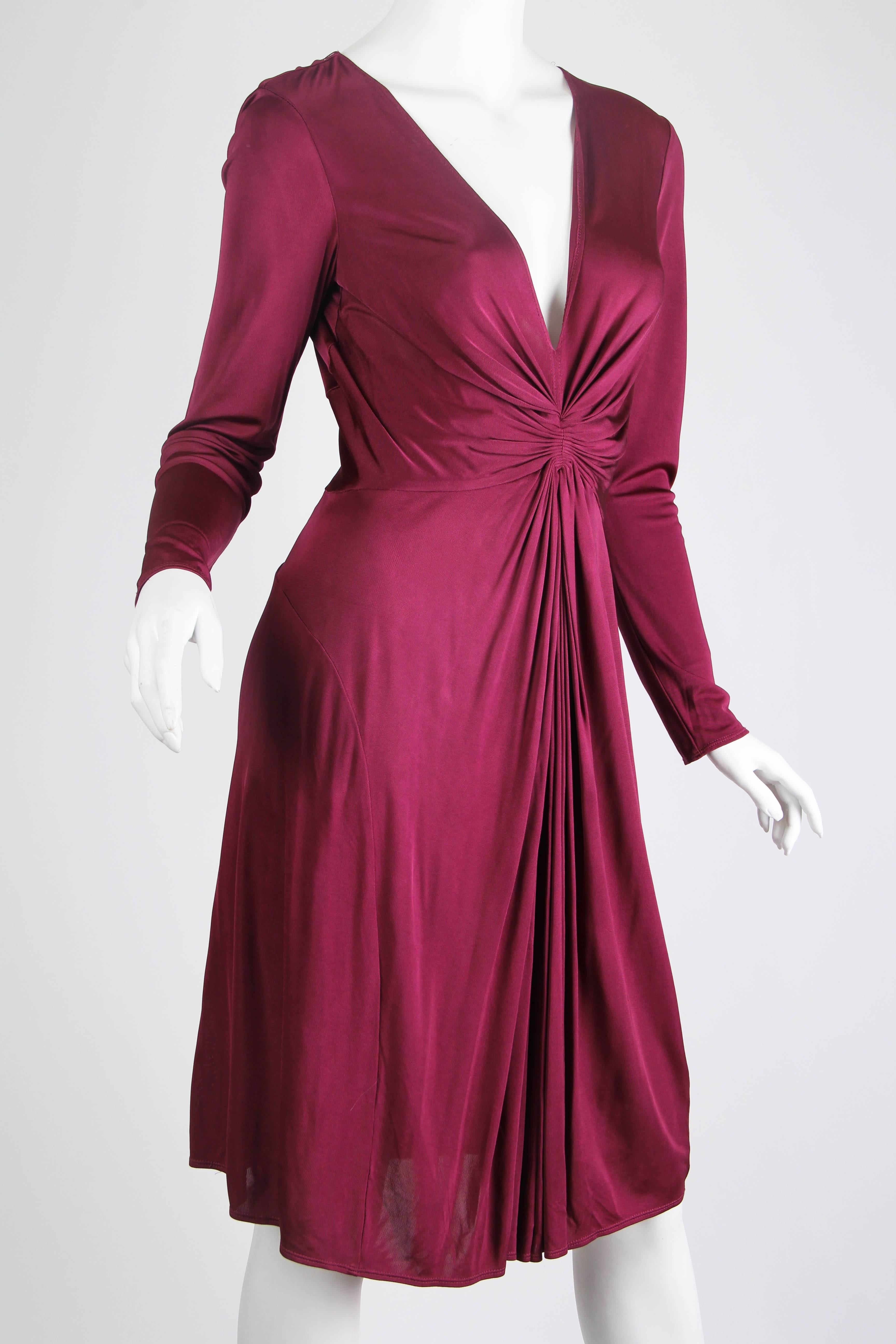 Gorgeous body flowing and flattering cut to this luscious dress from none other than Alexander McQueen. 