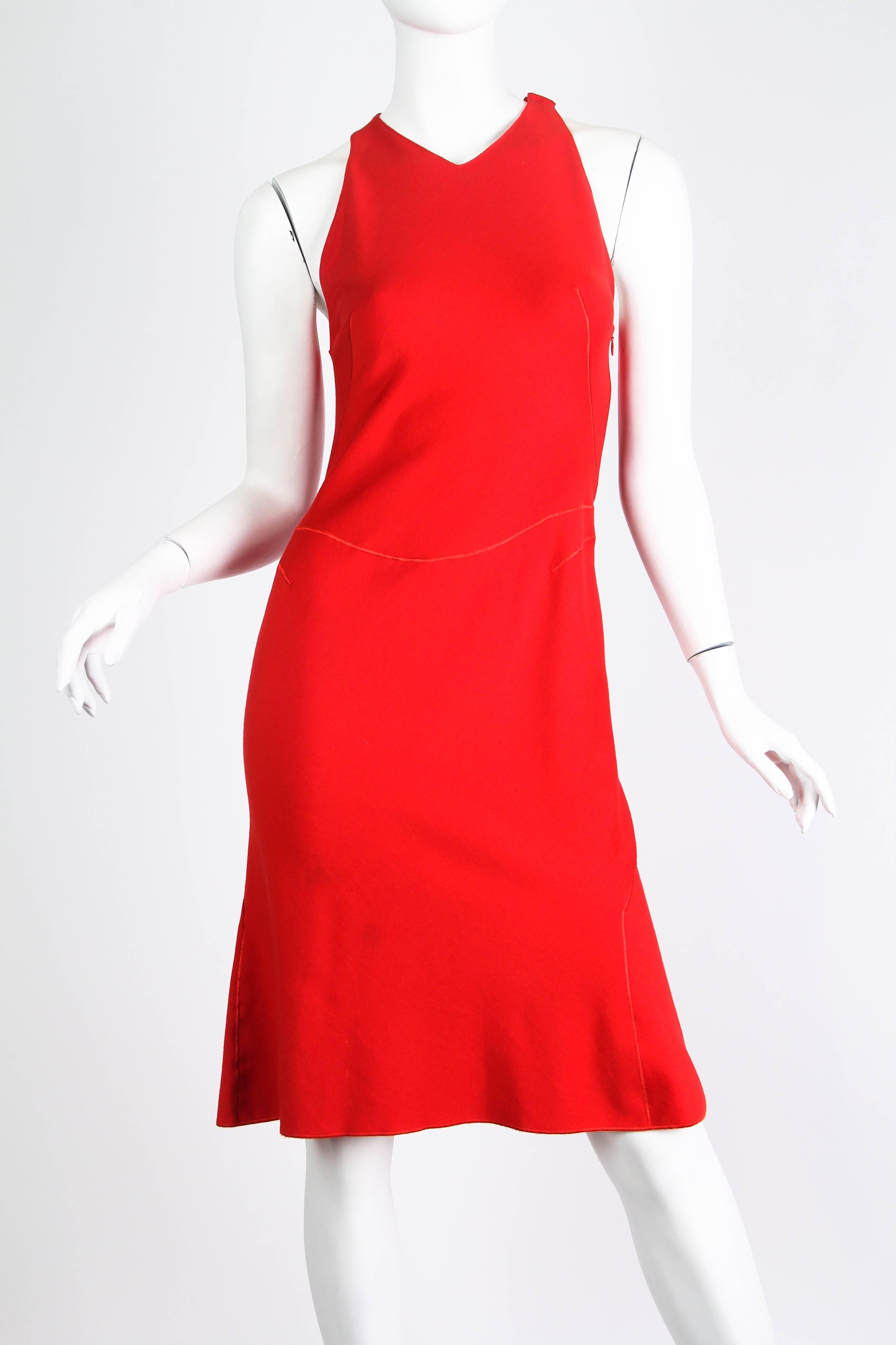 Gorgeous little dress from the man who knows best how to cut for a woman's figure. His designs are almost always done in his iconic black however this dress is in a gorgeous red which is exciting and rare. 