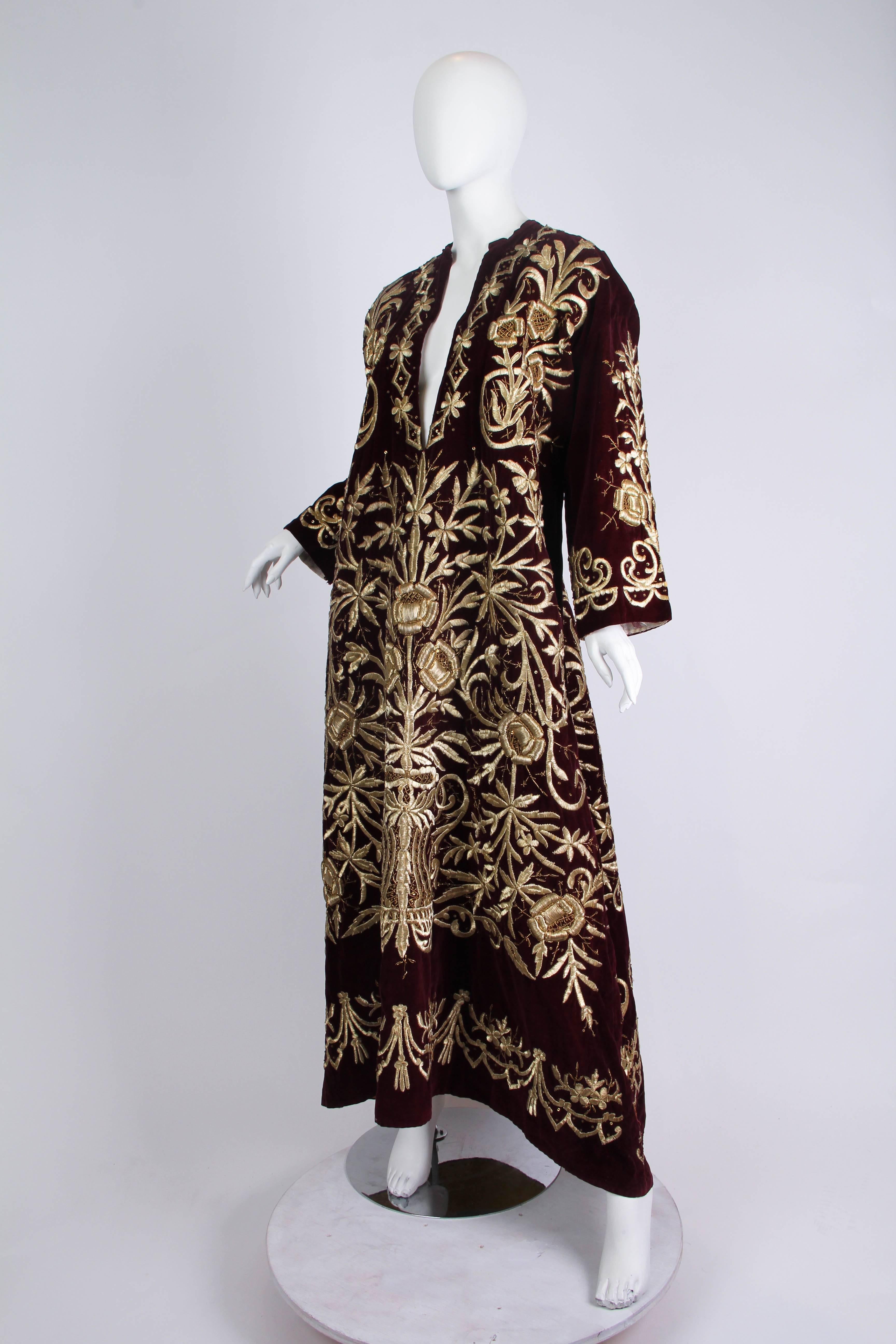 Worn primarily by upper-class women in Aleppo and Damascus, this style of richly embroidered cotton-velvet dress exhibits both European and Ottoman influences. The exquisite embroidery was embellished by professional women in Hama. They used a