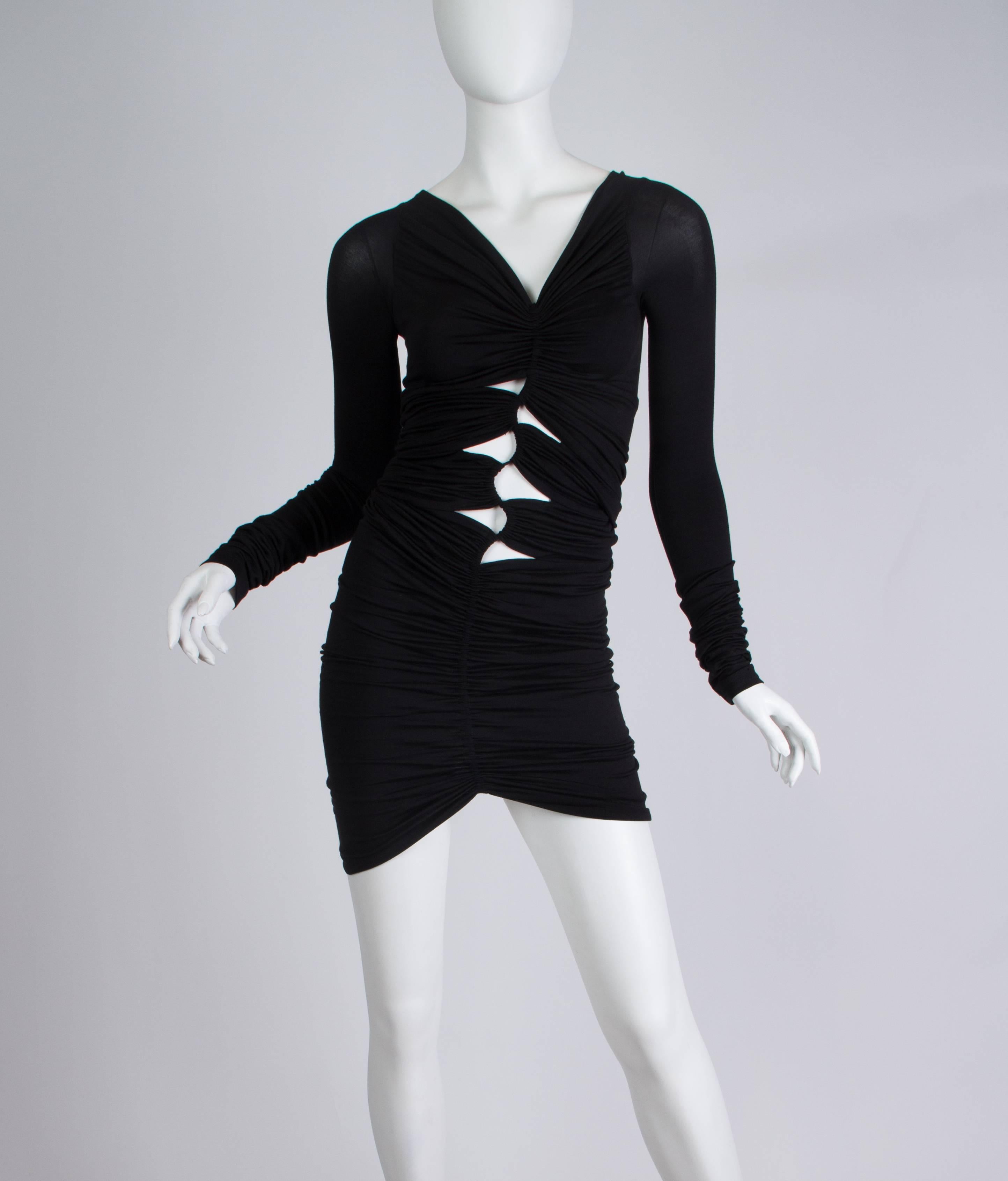 All ruched up the center front this revealing dress is a party to wear. 