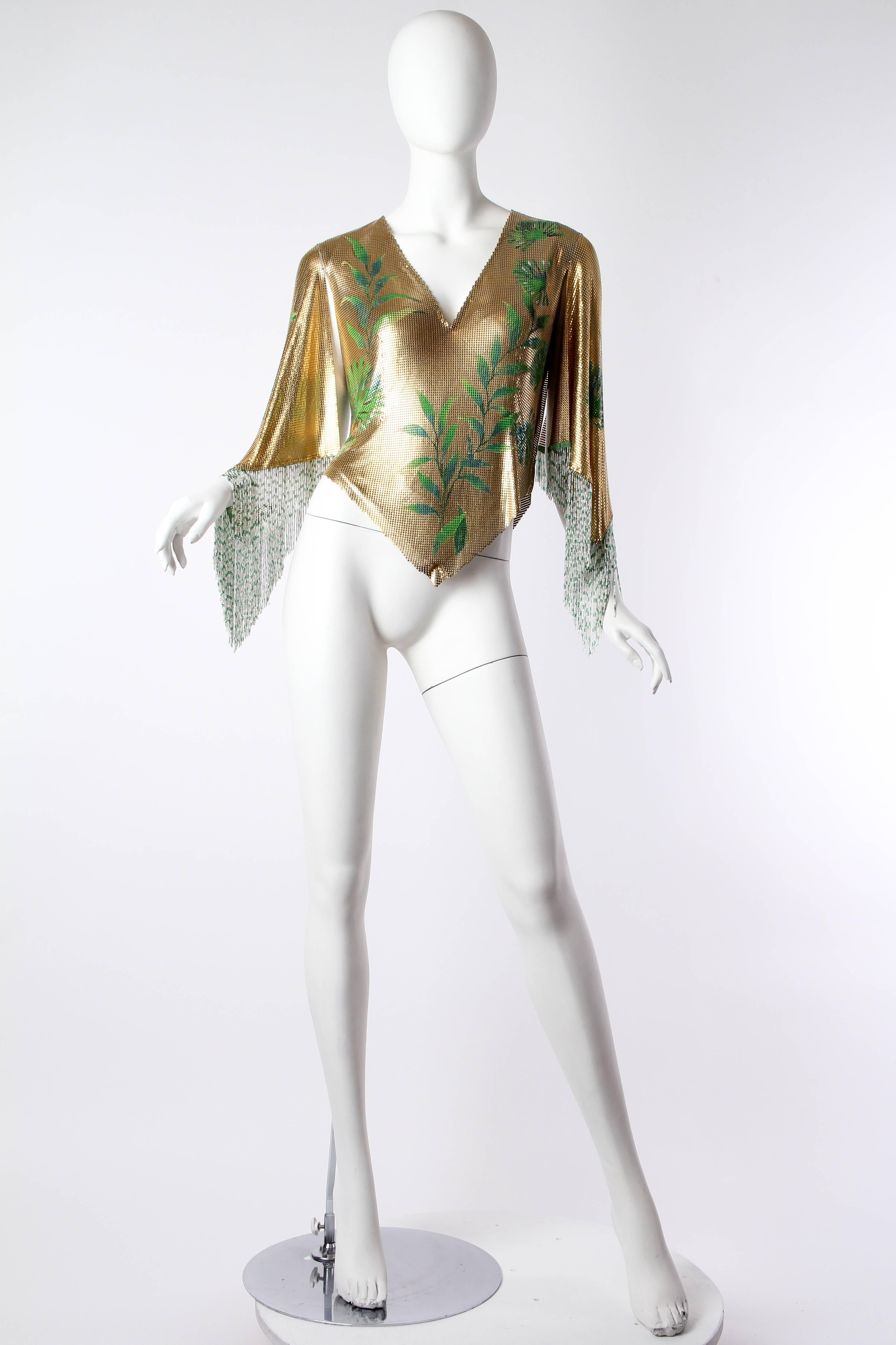 Unheard of effortless glamour in this museum piece from the late 21st century's most ostentatiously luxurious designer. This same fortune teller can be seen in an Atelier Versace silk scarf from the period. The piece is fully lined and in phenomenal