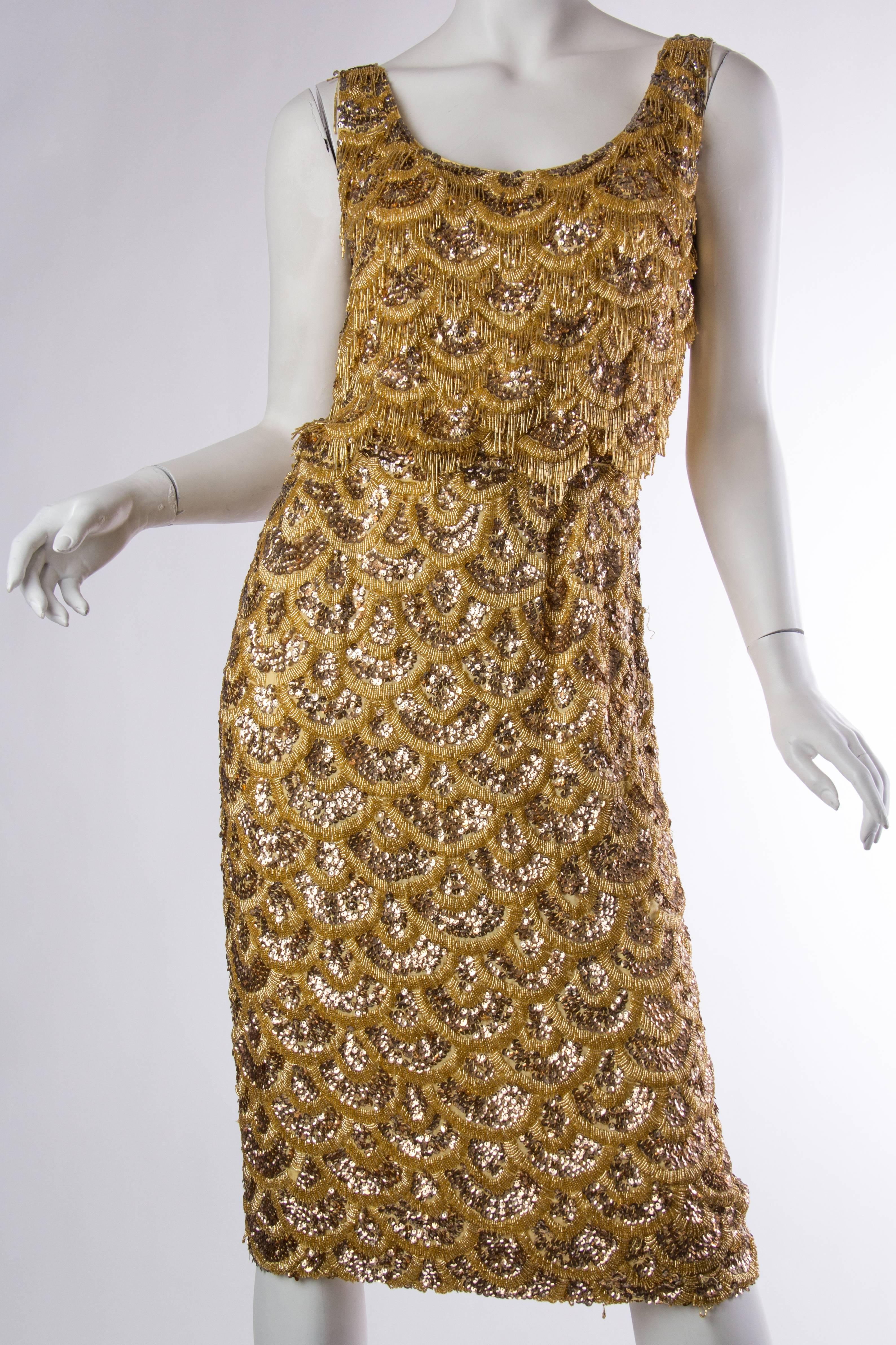 Early 1960s Beaded Gold Fringe Bombshell Mermaid Dress. There are some minor areas of loose beads as shown. We can have them all fixed and re-beaded for the buyer for an additional $300. Overall though this very rare dress is phenomenal and in very