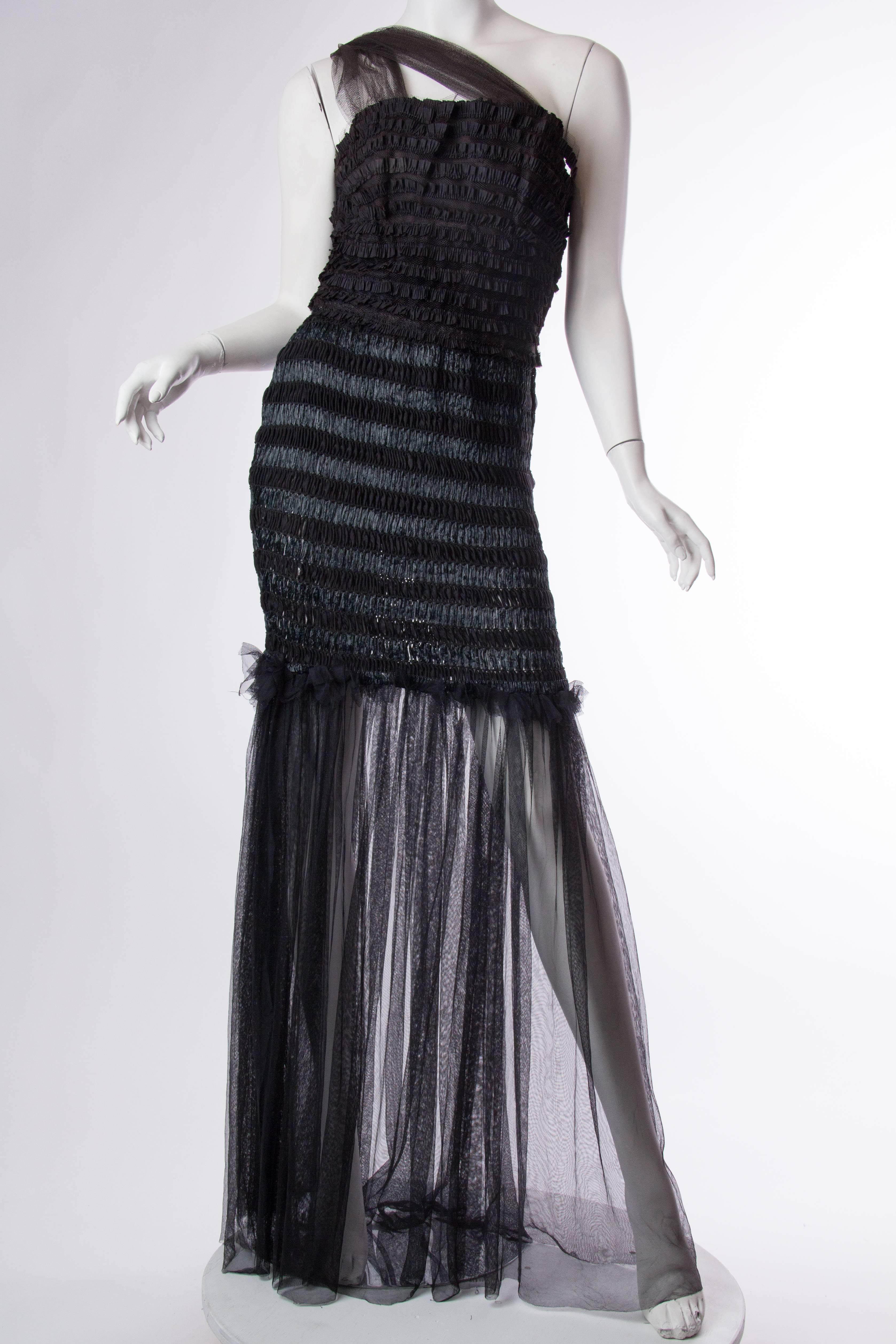 Rebuilt from several elements from the 1950s this dress takes the designs of the past and makes them current for today. 