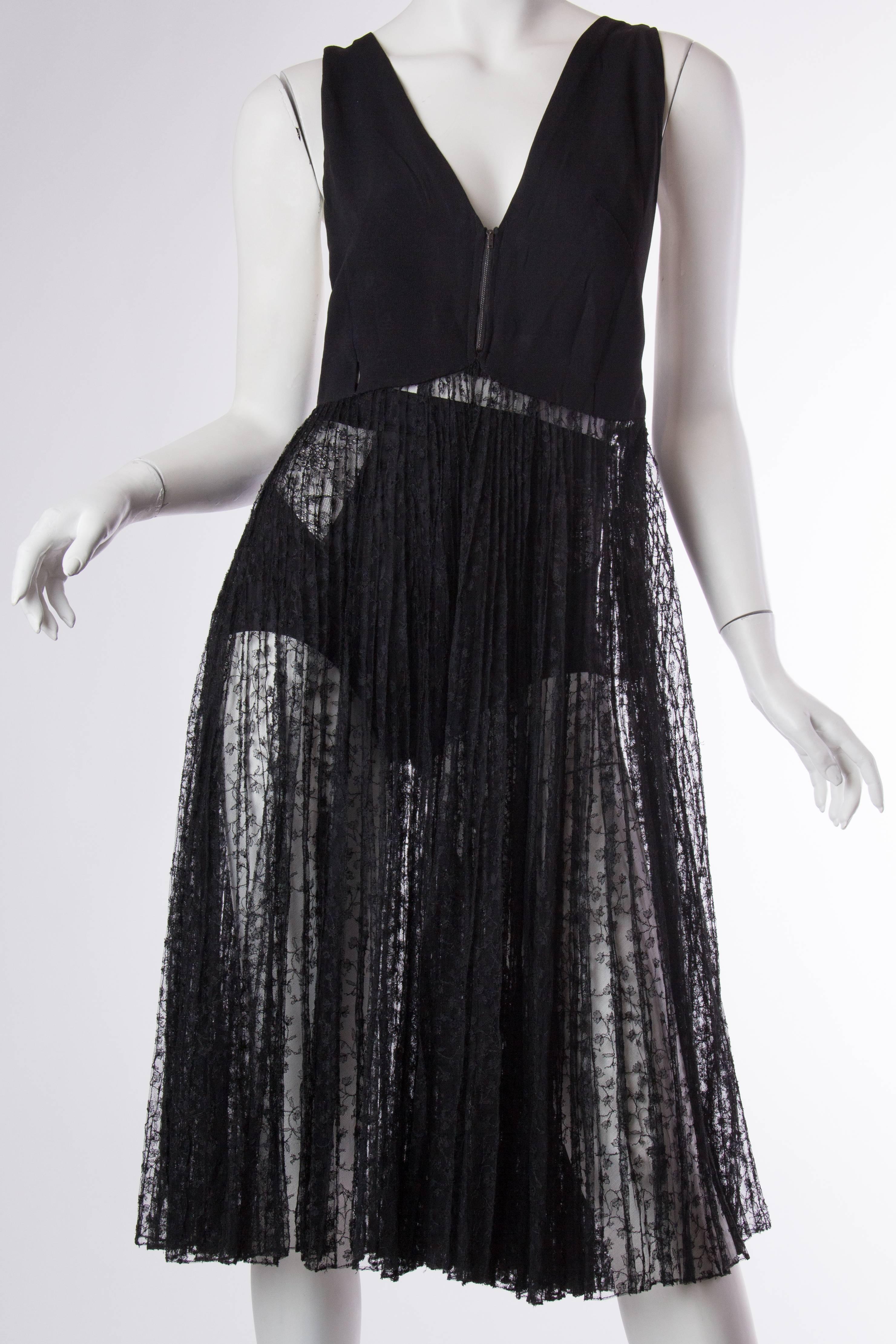1930s and 1970s rebuilt and married together sheer vintage black lace dress and cut out back  

the skirt of this dress is made from 1930s lace.  The 1970s racer back lace finishes the back.