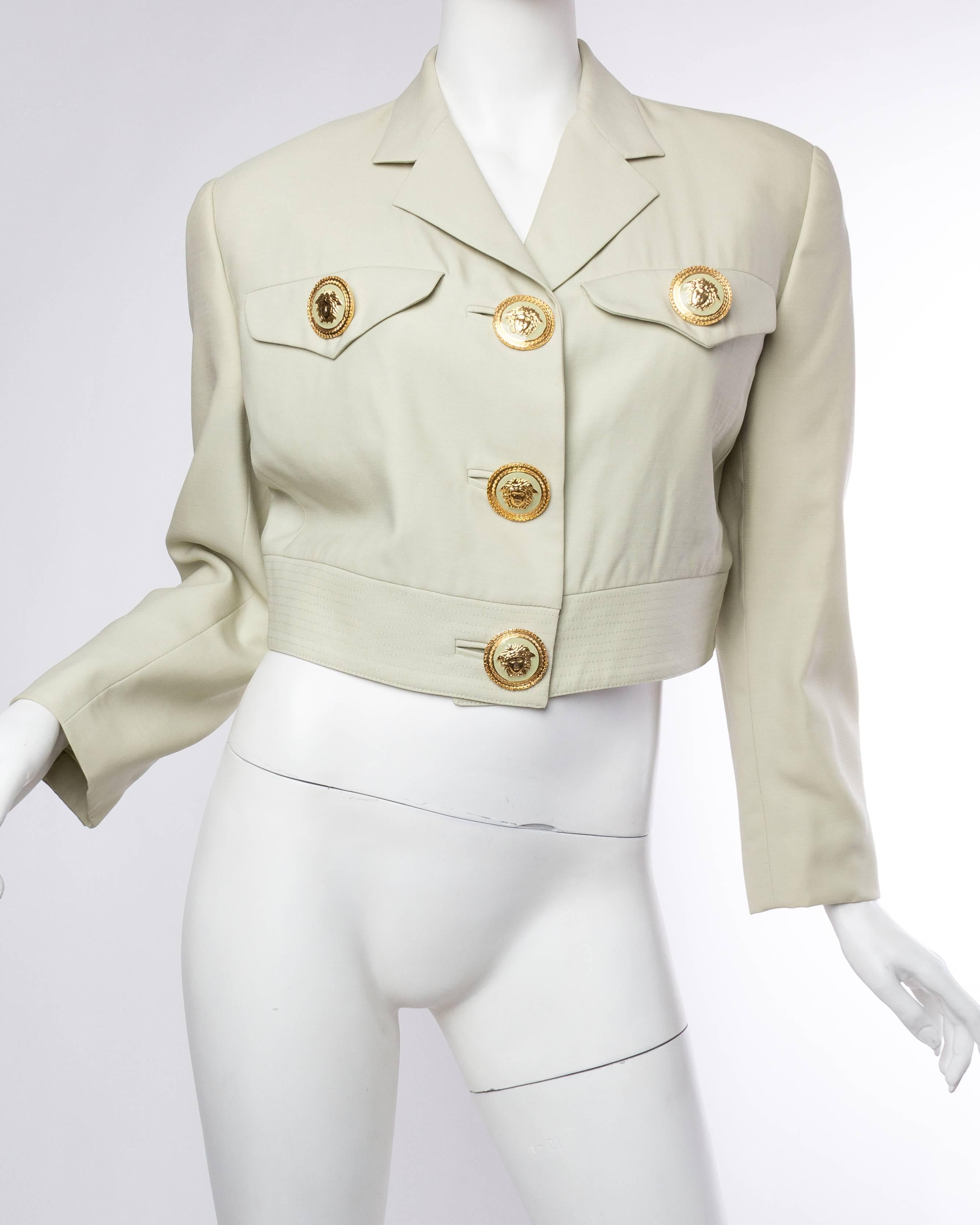 Dating from the early 1990s this pastel jacket, originally sold at Bergdorf Goodman, is adorned with large fantastic Medusa buttons. 