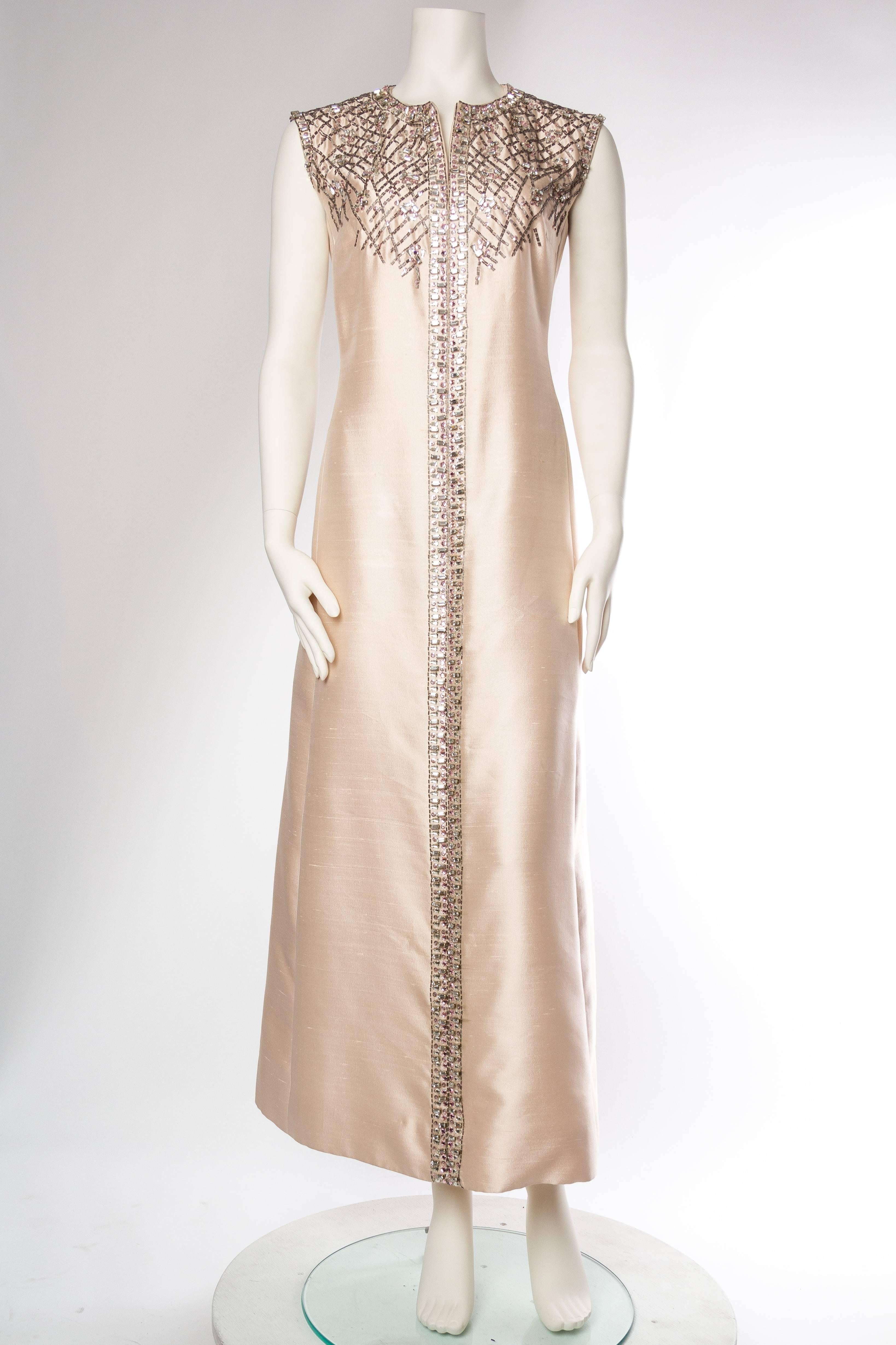 Fantastic and expensive sparkle to the prong set cut crystals in both pink and clear, with bugle beads emulating broken glass.  1960S CHRISTIAN DIOR Style Baby Pink Silk Blend Radzimir Crystal Encrusted Mod Gown 