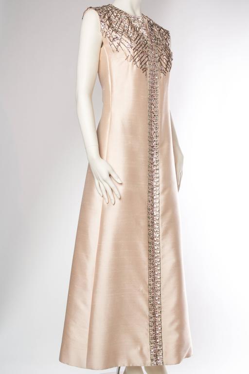 Strikingly Modern Oyster Pink Gown Heavily Embelished with Crystals For