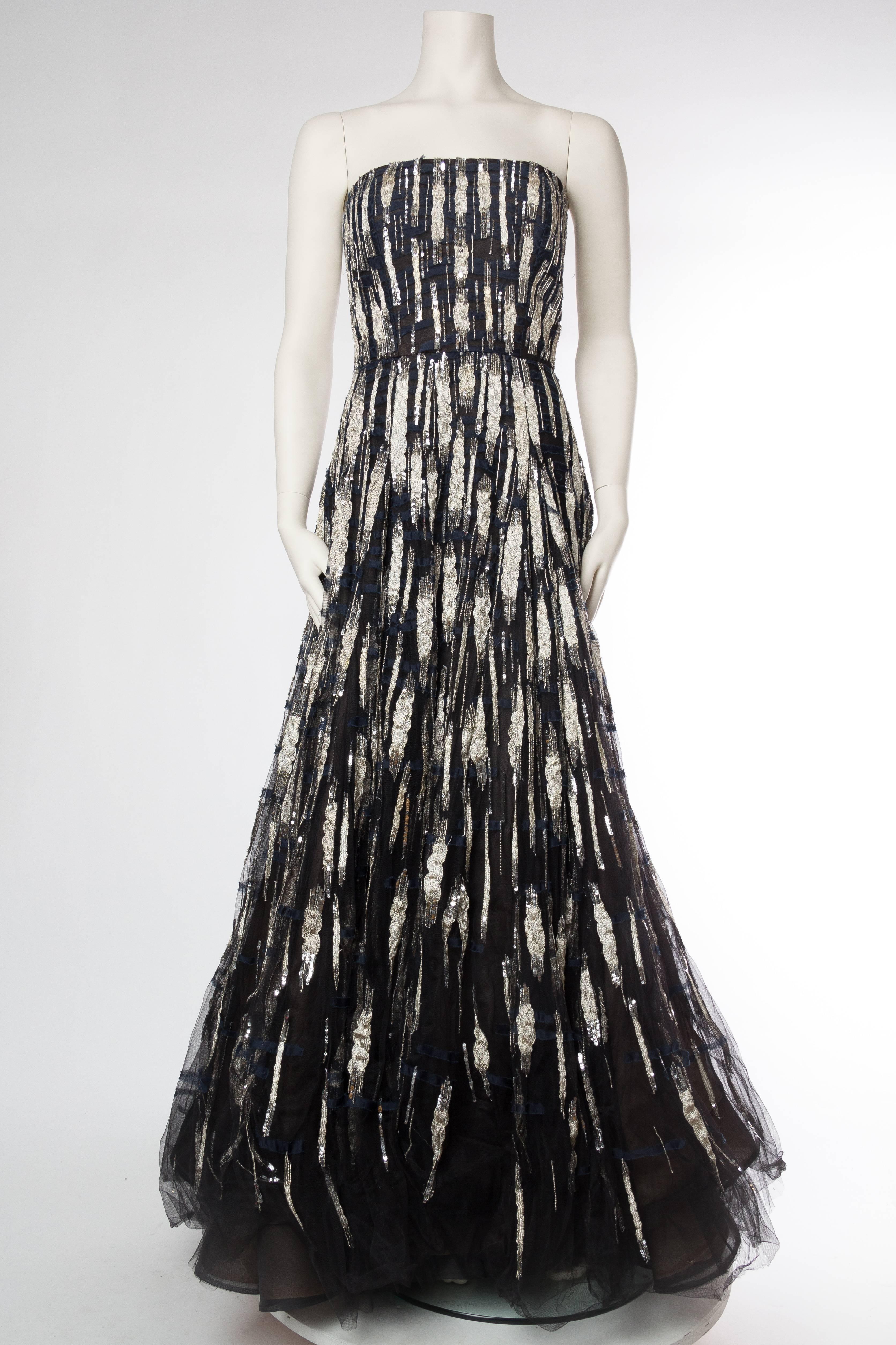 Oscar De La Renta Beaded Tulle Gown with Metallic silver and shredded chiffon appliques. Tagged size 6 but runs large. 