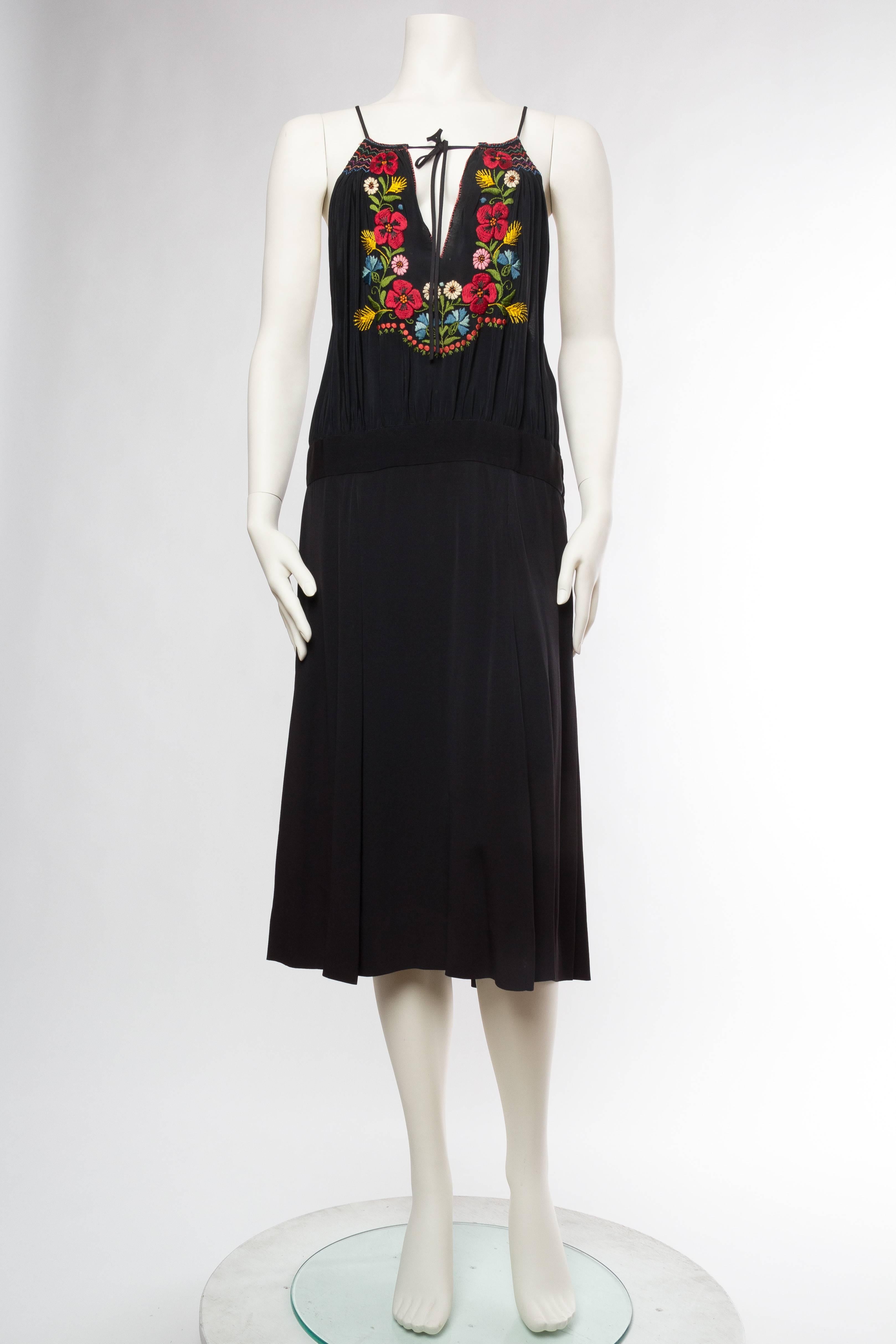 MORPHEW COLLECTION Black Rayon Bohemian Embroidered Dress With Flowers & Hand Smocking
MORPHEW COLLECTION is made entirely by hand in our NYC Ateliér of rare antique materials sourced from around the globe. Our sustainable vintage materials