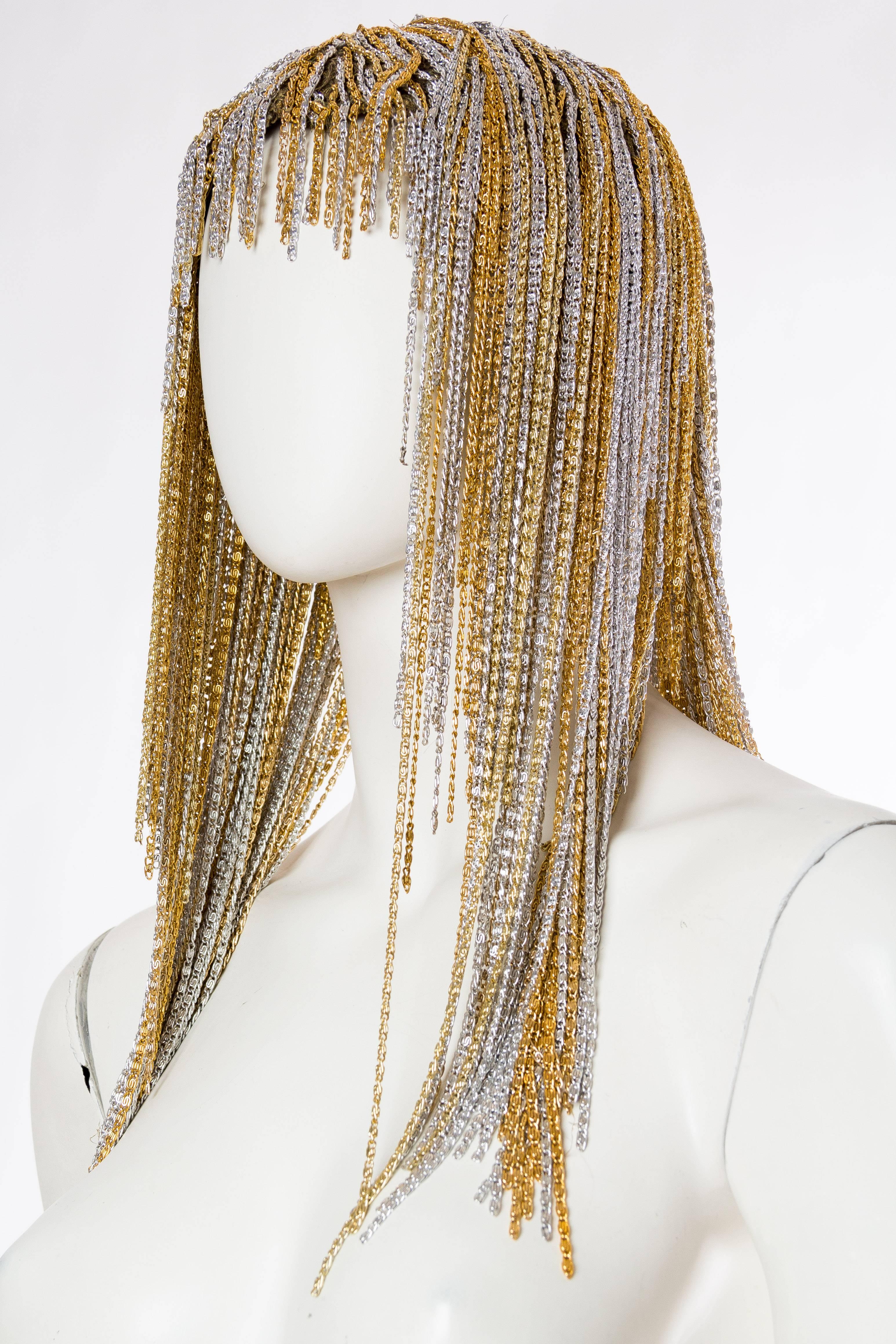 Made from antique metal lamé from the 1920s, however the chain is the same we have on several of our Azzaro pieces from the 1970s. This piece is tricky to date. Age aside there is no question as to how sensual and gorgeous this chain wig is. The