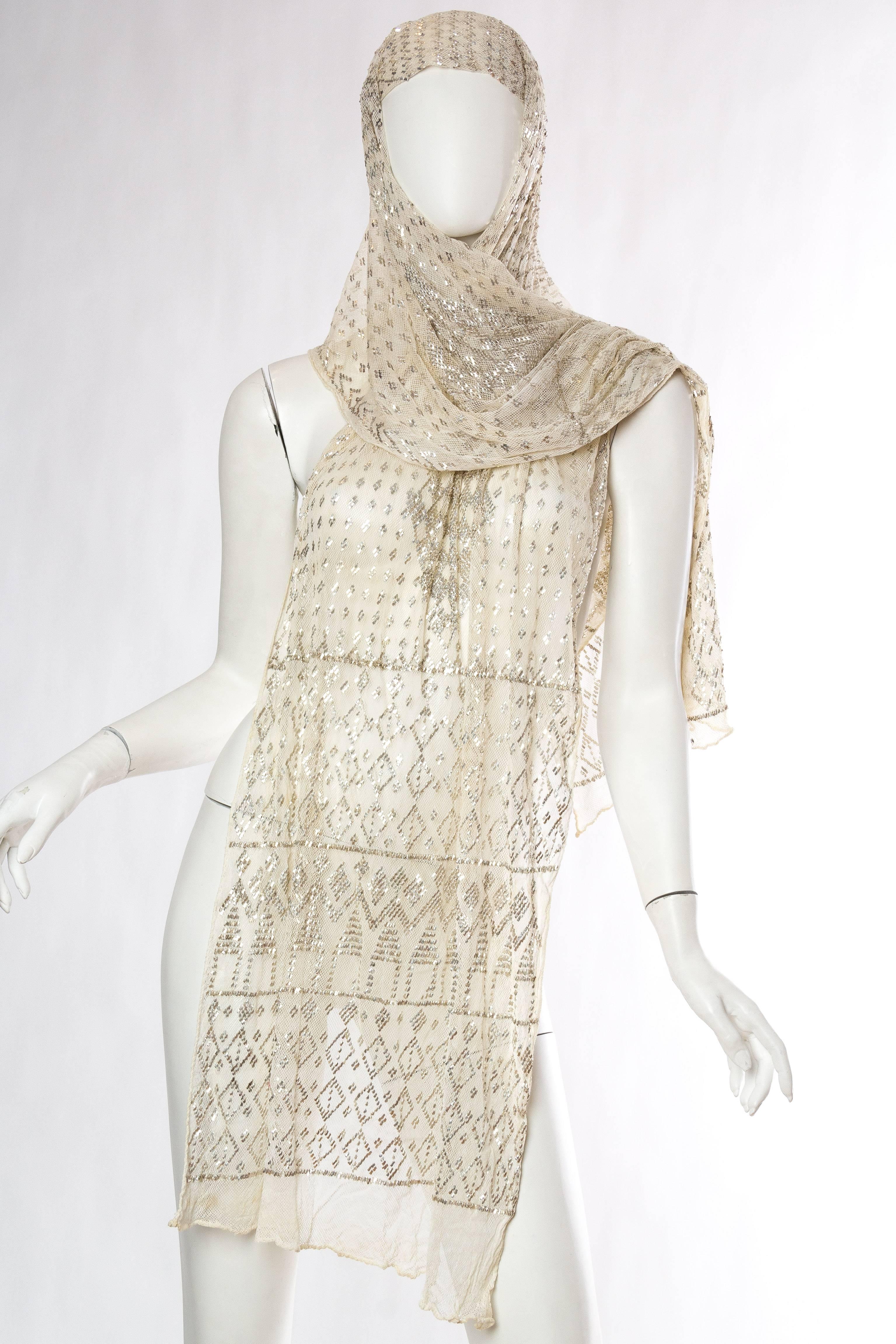 Shawl is in good clean condition and has been woven with silver metal to add weight and glimmer. Pinned on the mannequin to show how it can also become a dress which we can sew for you if you desire. 