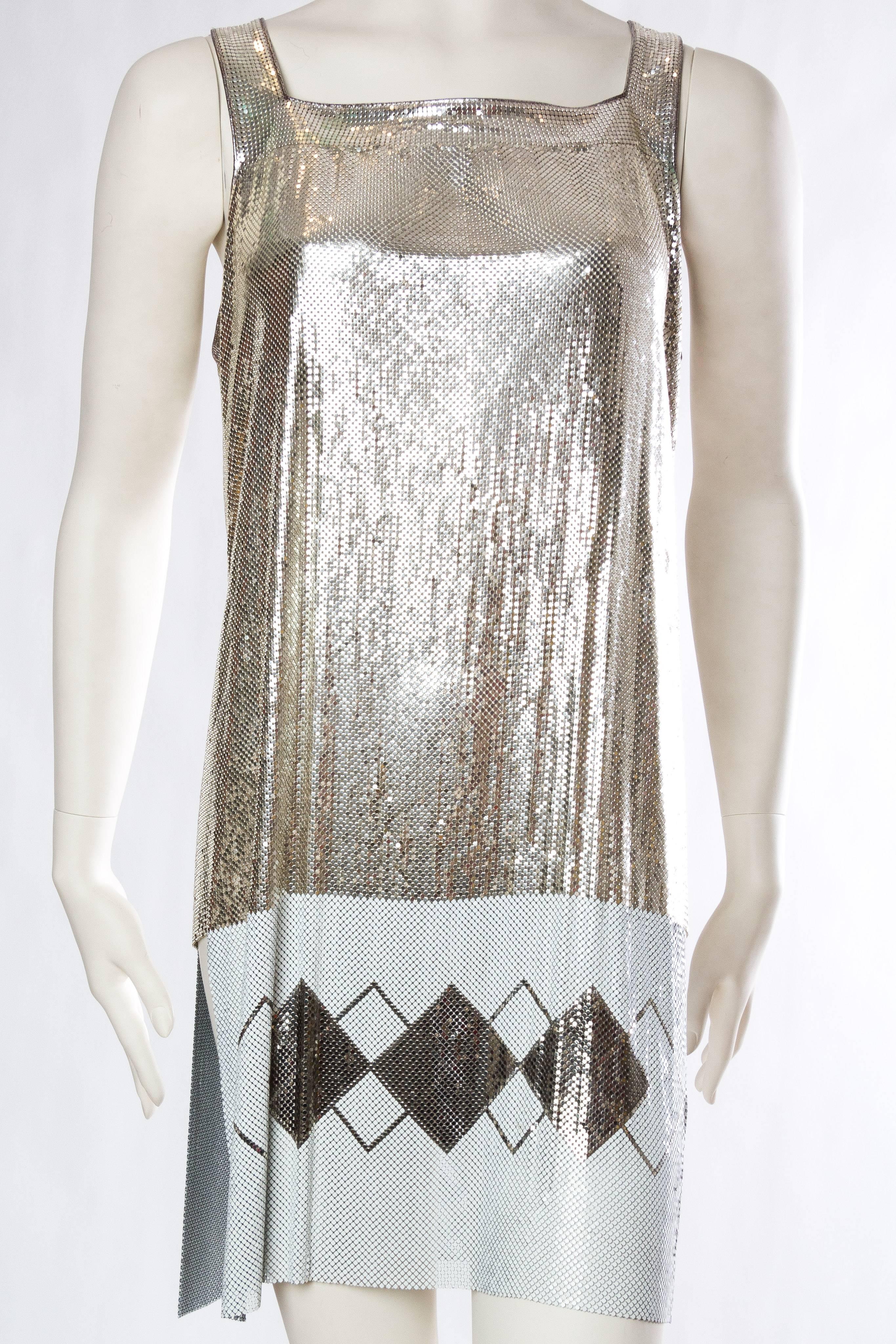 MORPHEW COLLECTION Silver & White Metal Mesh Deco Patterned  Cocktail Dress With Side Slits Made From Vintage Whiting Davis
MORPHEW COLLECTION is made entirely by hand in our NYC Ateliér of rare antique materials sourced from around the globe. Our