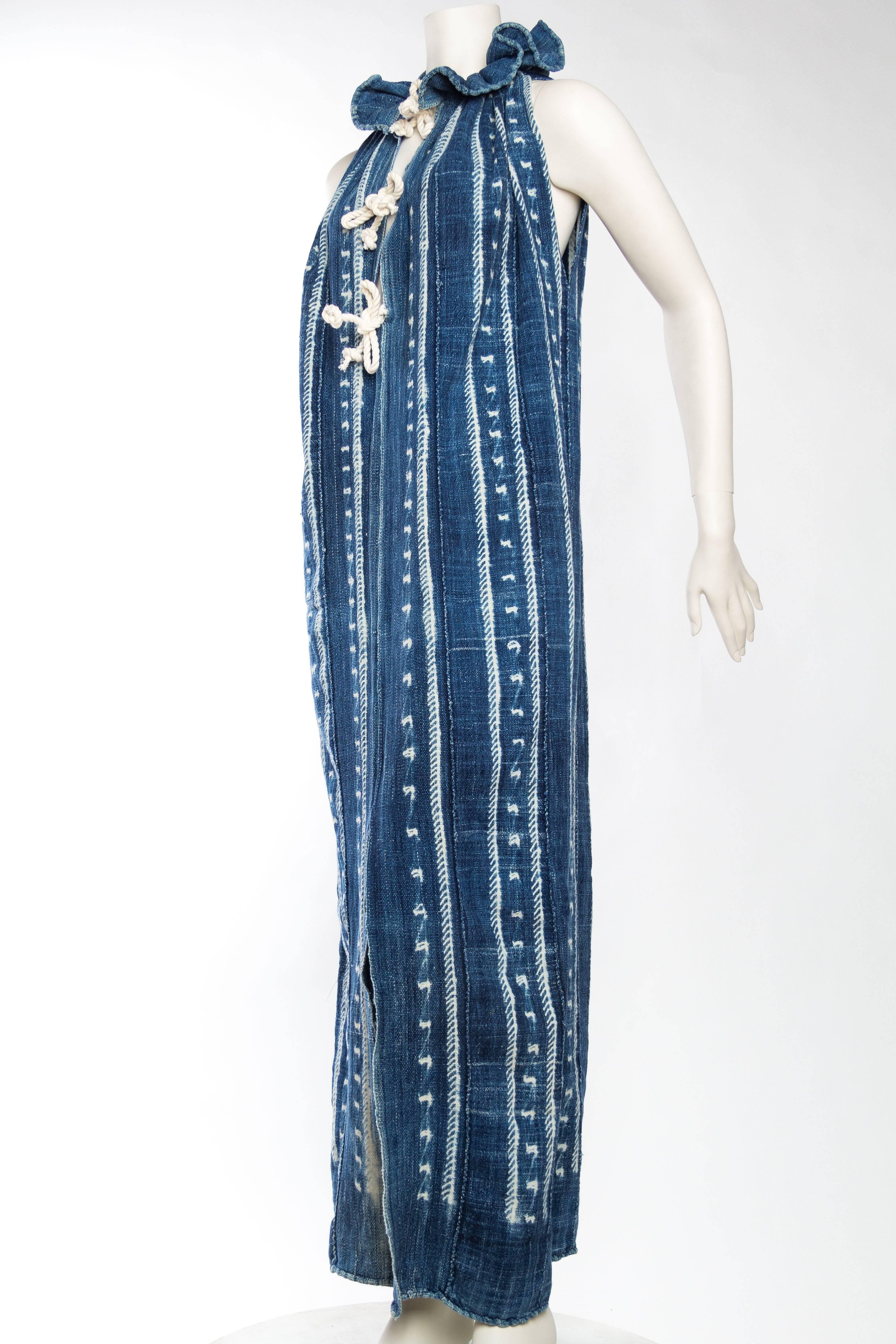 made from antique hand tie-dyed indigo fabric from west Africa. This dress is cut loose and easy with three cotton ropes to tie closed up the front. 