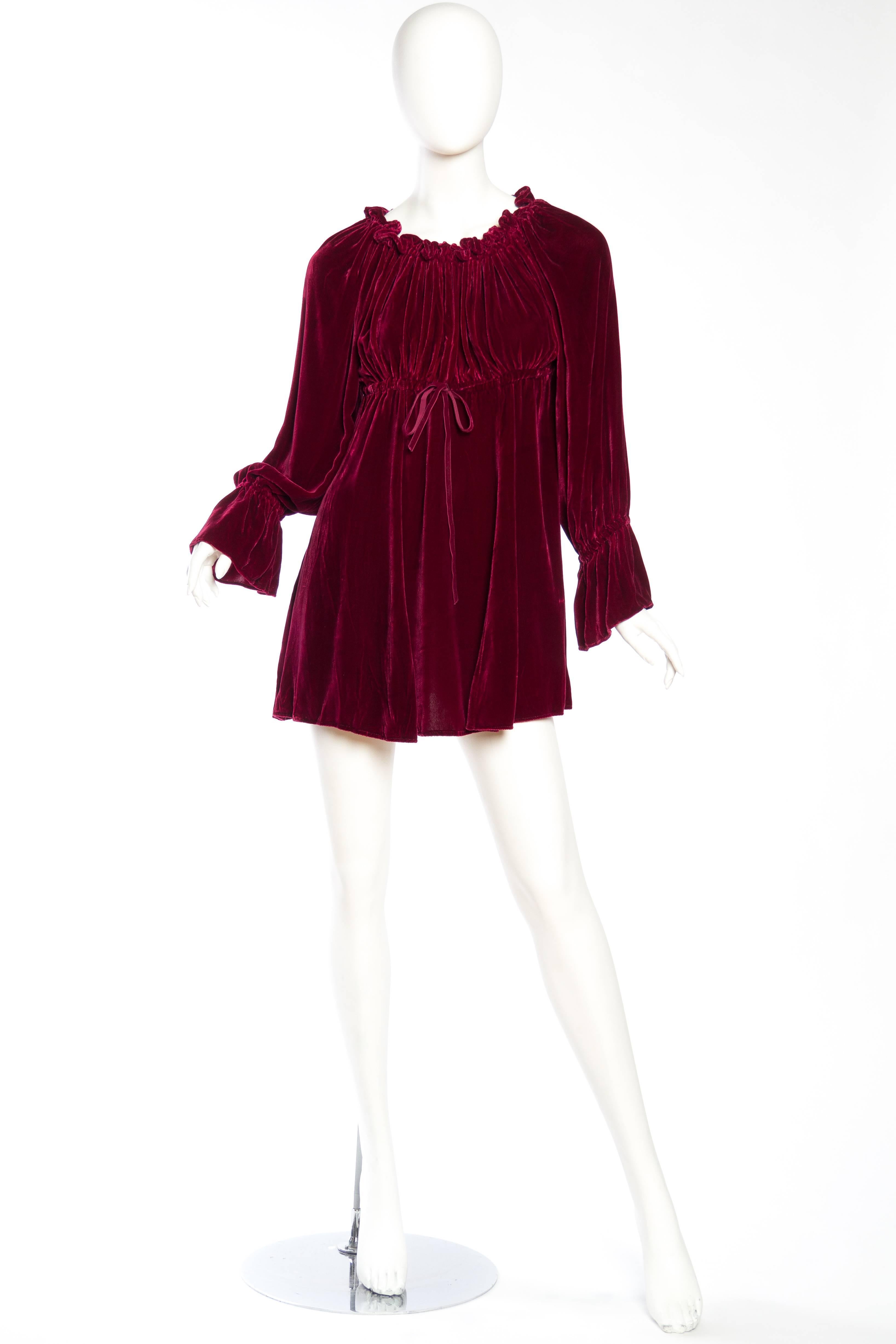 This is a funny little dress. We bought it in Paris, with a French label, which says made in the USA. The style is total swinging 1960s rock and roll Paris however it dates from the 1990s. The velvet is luscious and more reminicent of the 1930s than