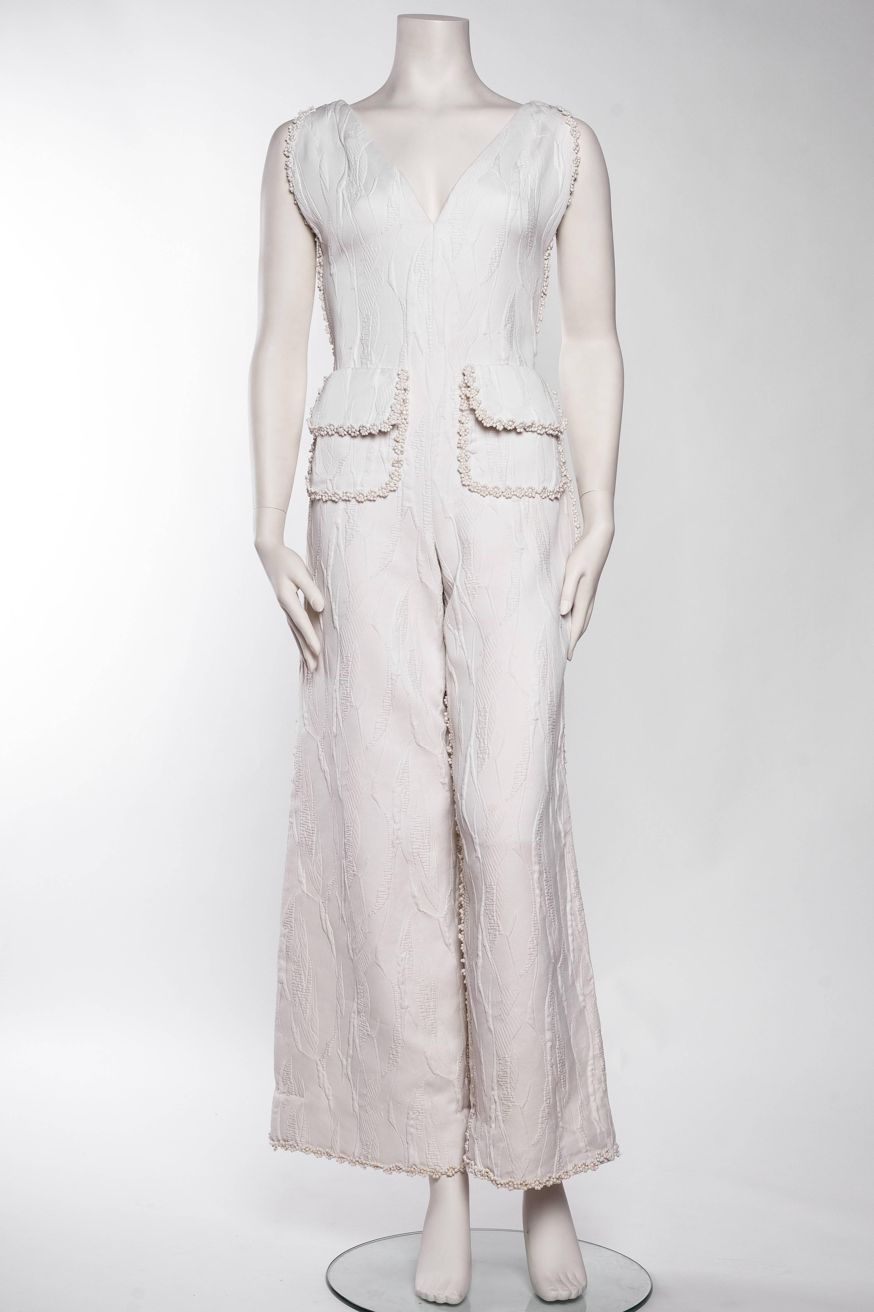 Galanos 1960 mod jumpsuit with jacquard fabric and daisy lace trim. 
