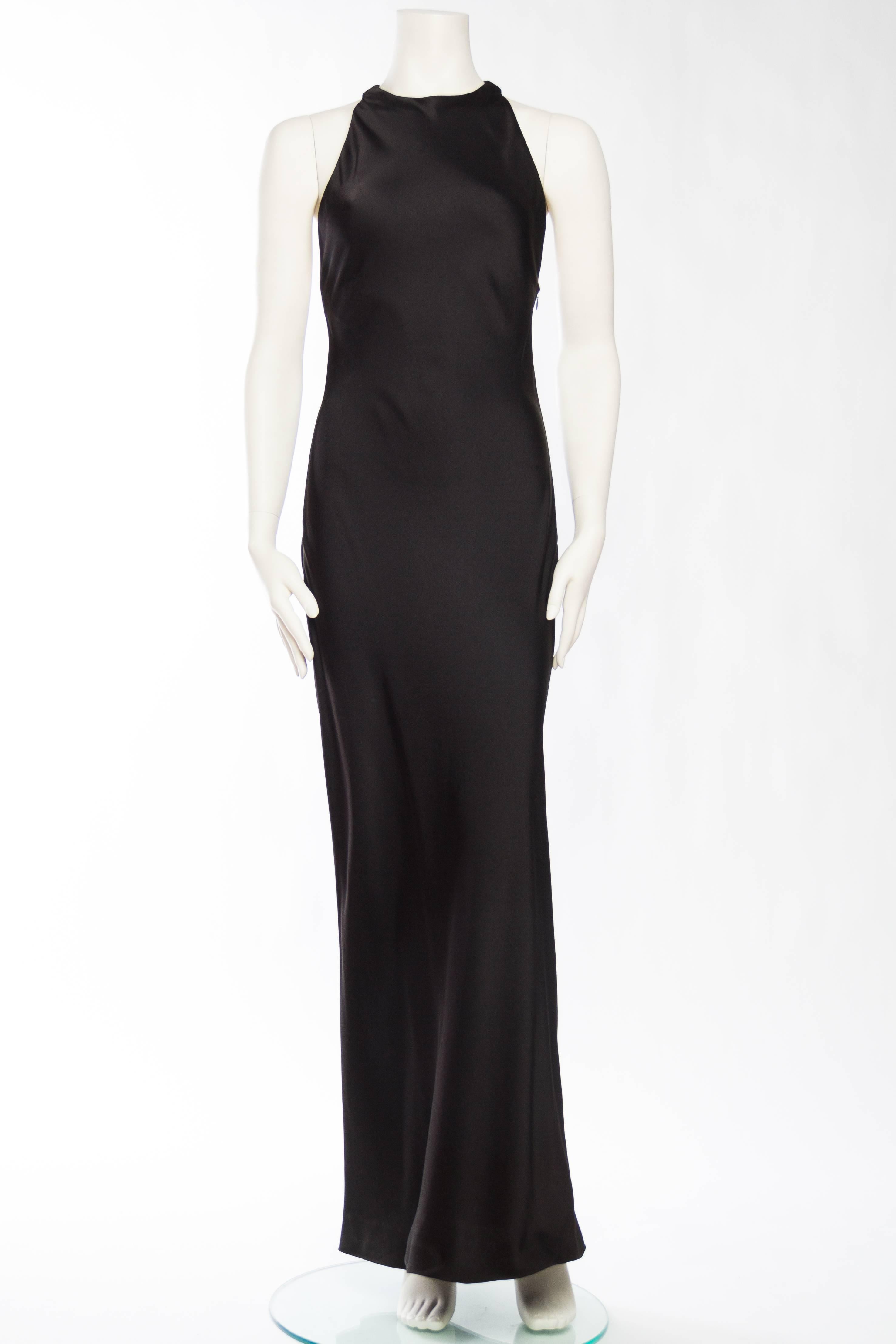 Gorgeous crepe backed satin slinks right down the body in this classic 1930s inspired bias-cut gown from YSL. Tagged a size 36 but being bias cut it can work for smaller sizes. 