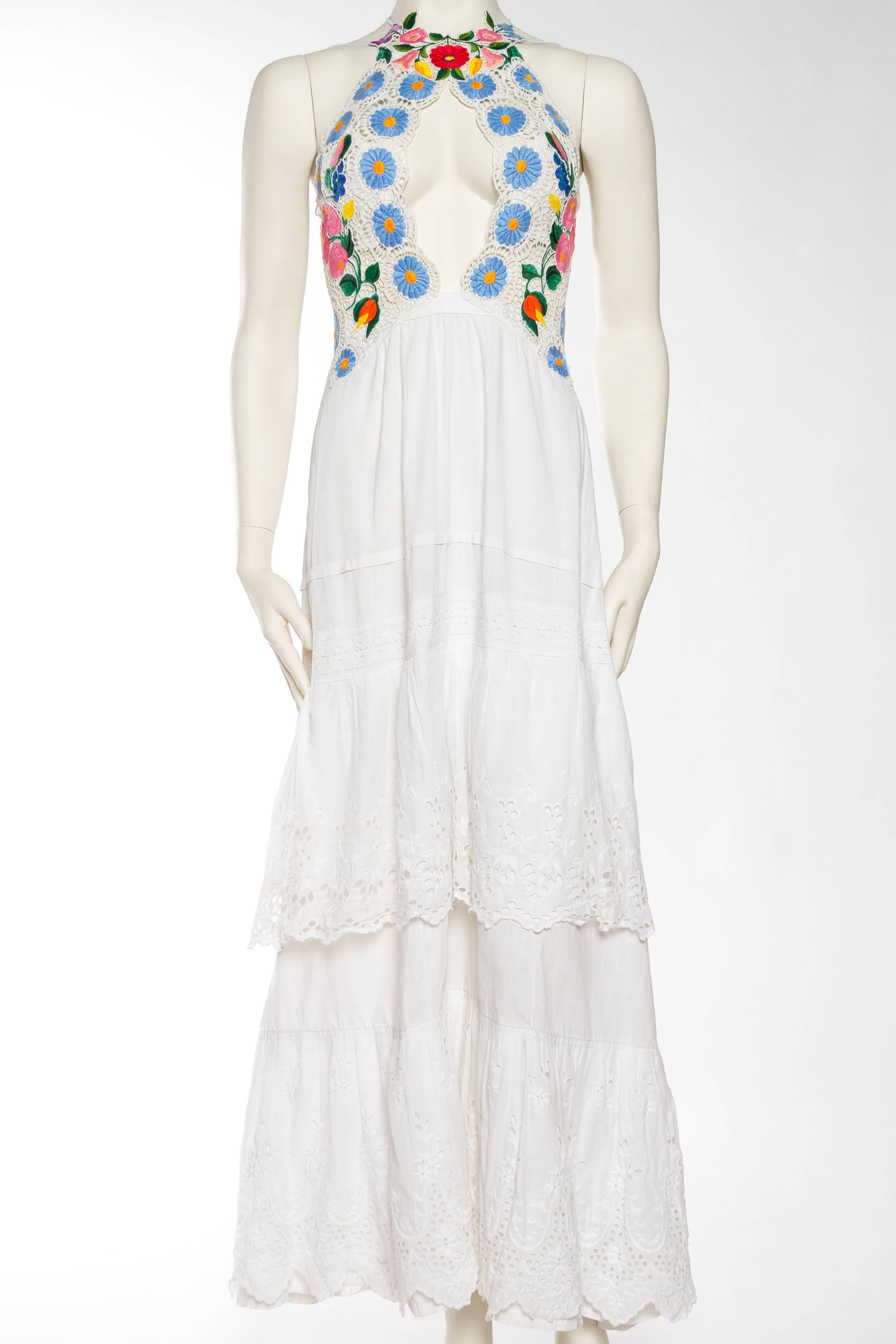 This sexy Morphew Lab stunner is built with a top made from hand embroidered, most likely Polish, lace dating to the late mid-century. All of the flowers are hand embroidered on a cotton base and cut and pieced together painstakingly by hand, a true
