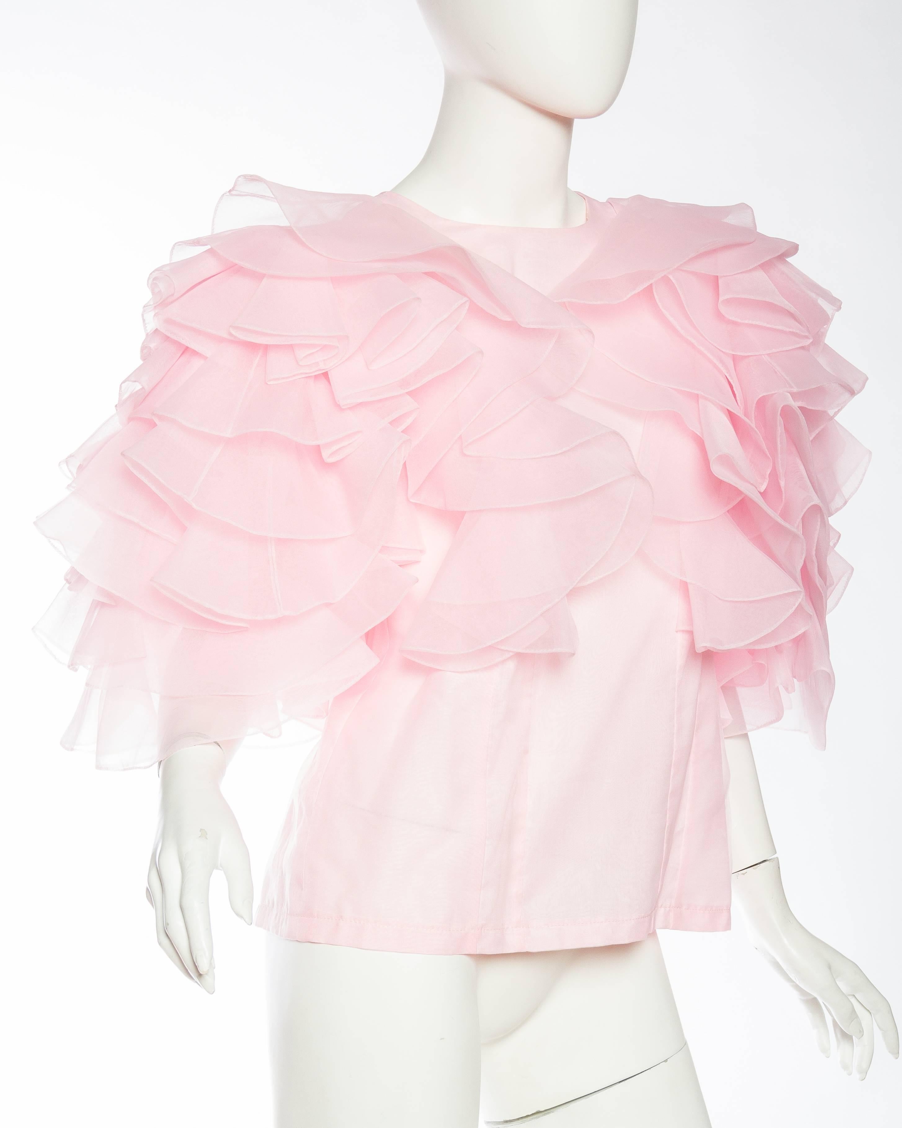 pink ruffled blouse