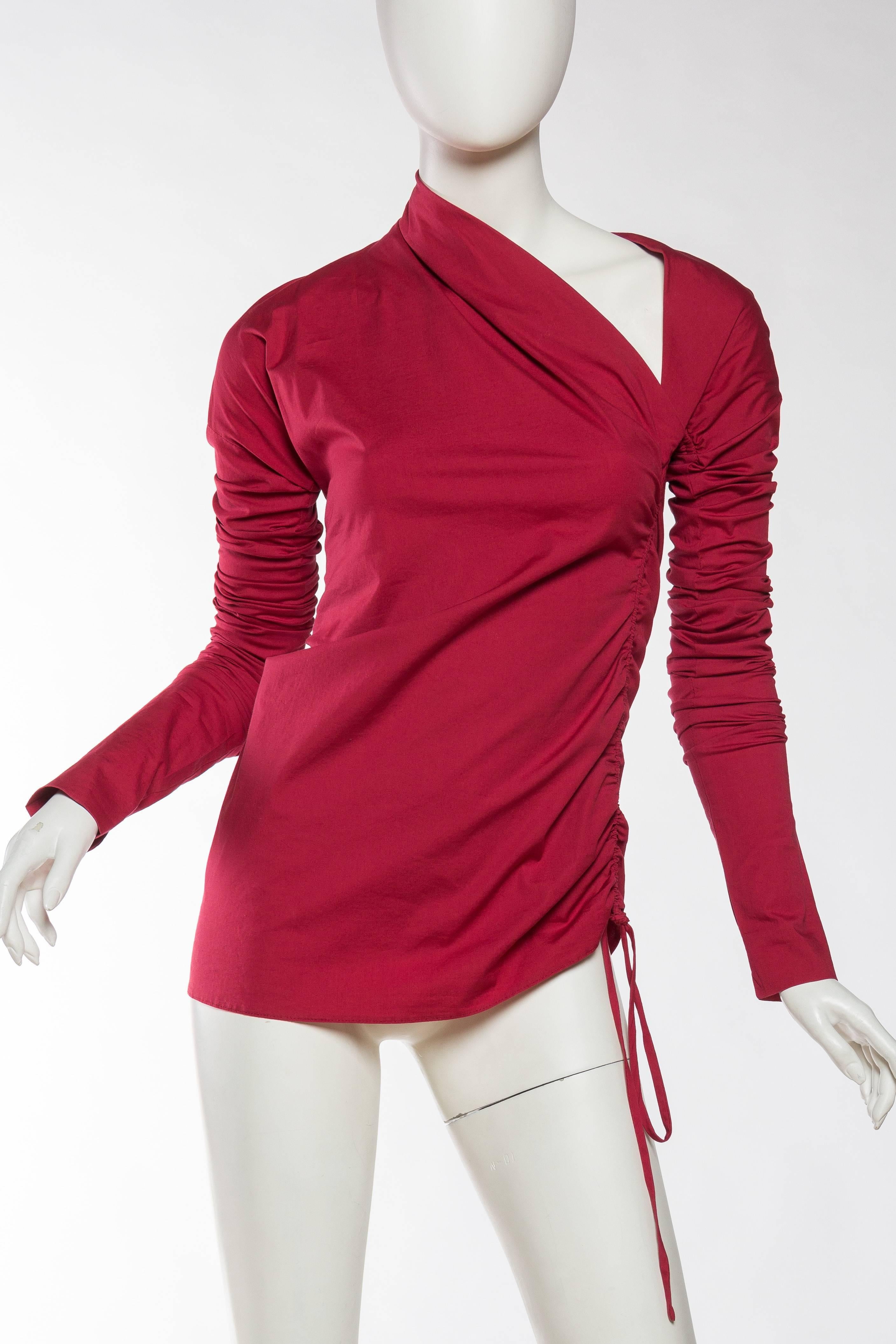 Asymmetrical ruching and a stretch to the fabric make this a killer top to remember.