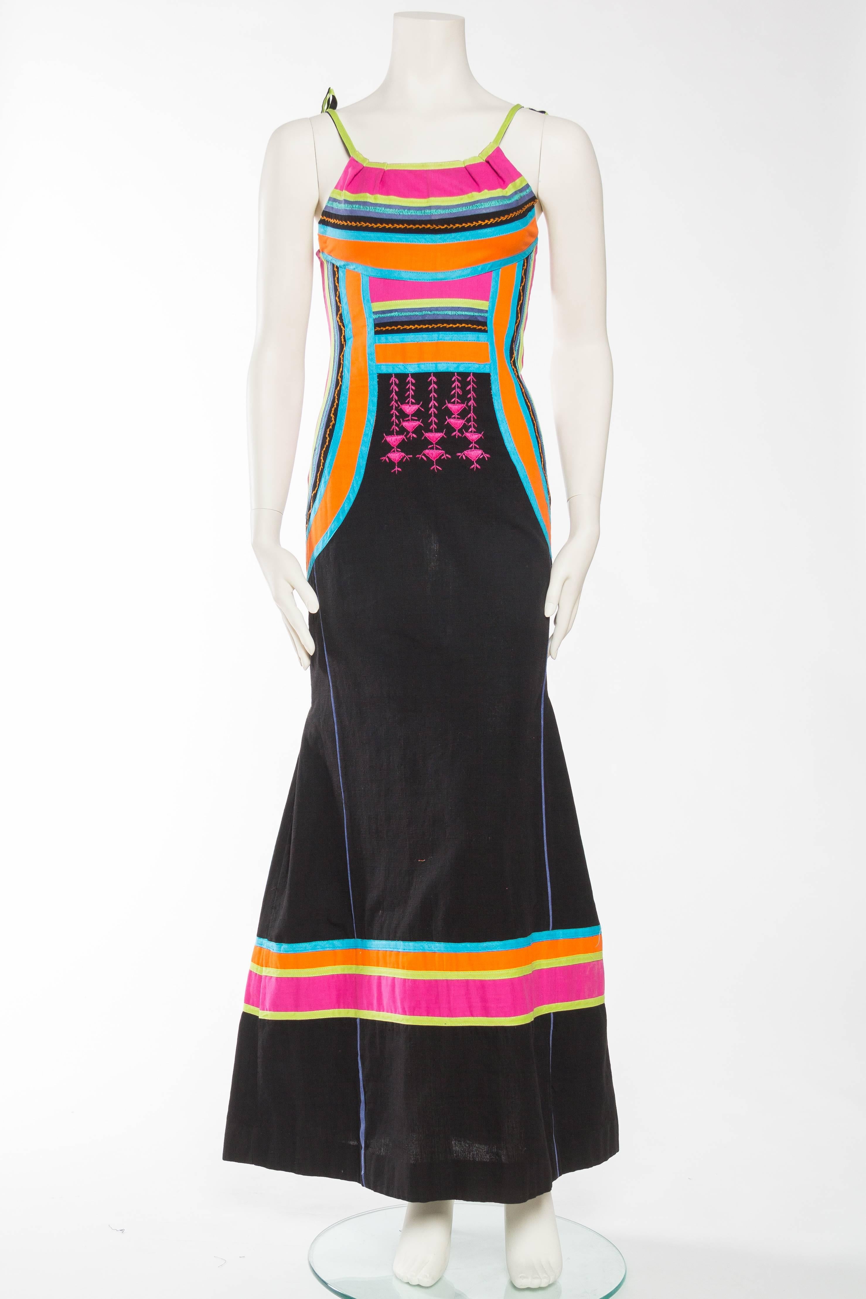 MORPHEW COLLECTION Black Cotton Maxi Dress With Neon Appliqué & Embroidery
MORPHEW COLLECTION is made entirely by hand in our NYC Ateliér of rare antique materials sourced from around the globe. Our sustainable vintage materials represent over a